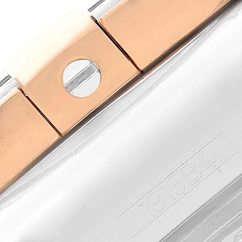 This is a close-up image of a bracelet link and clasp of a Breitling Galactic C37330 Men's Steel and Gold (two tone) Mother of Pearl Dial C37330 Men's Steel and Gold (two tone) Mother of Pearl Dial watch.