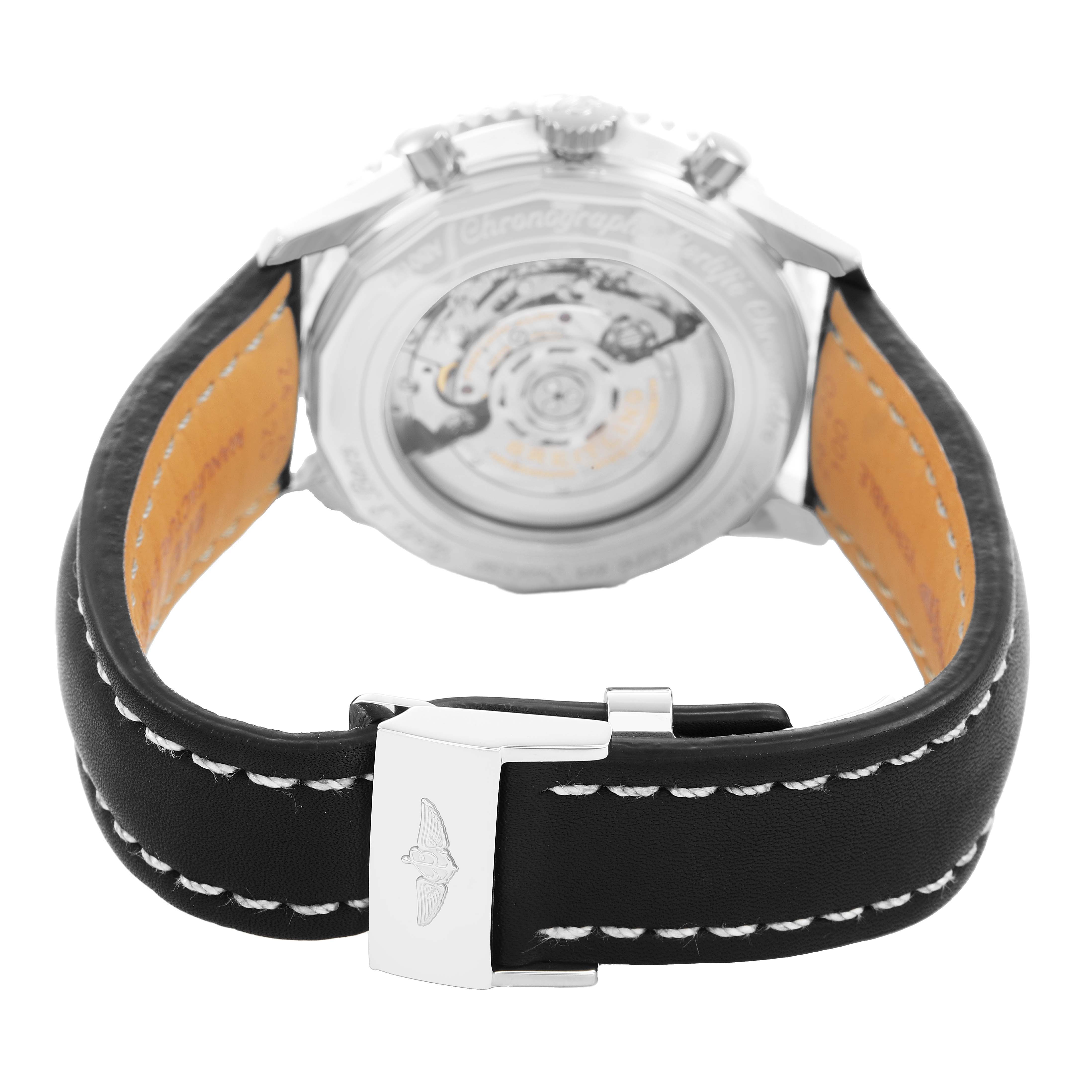 The Breitling Navitimer AB0127 Men's Stainless Steel Black Dial watch is shown from the rear, highlighting the open case back, leather strap, and clasp.