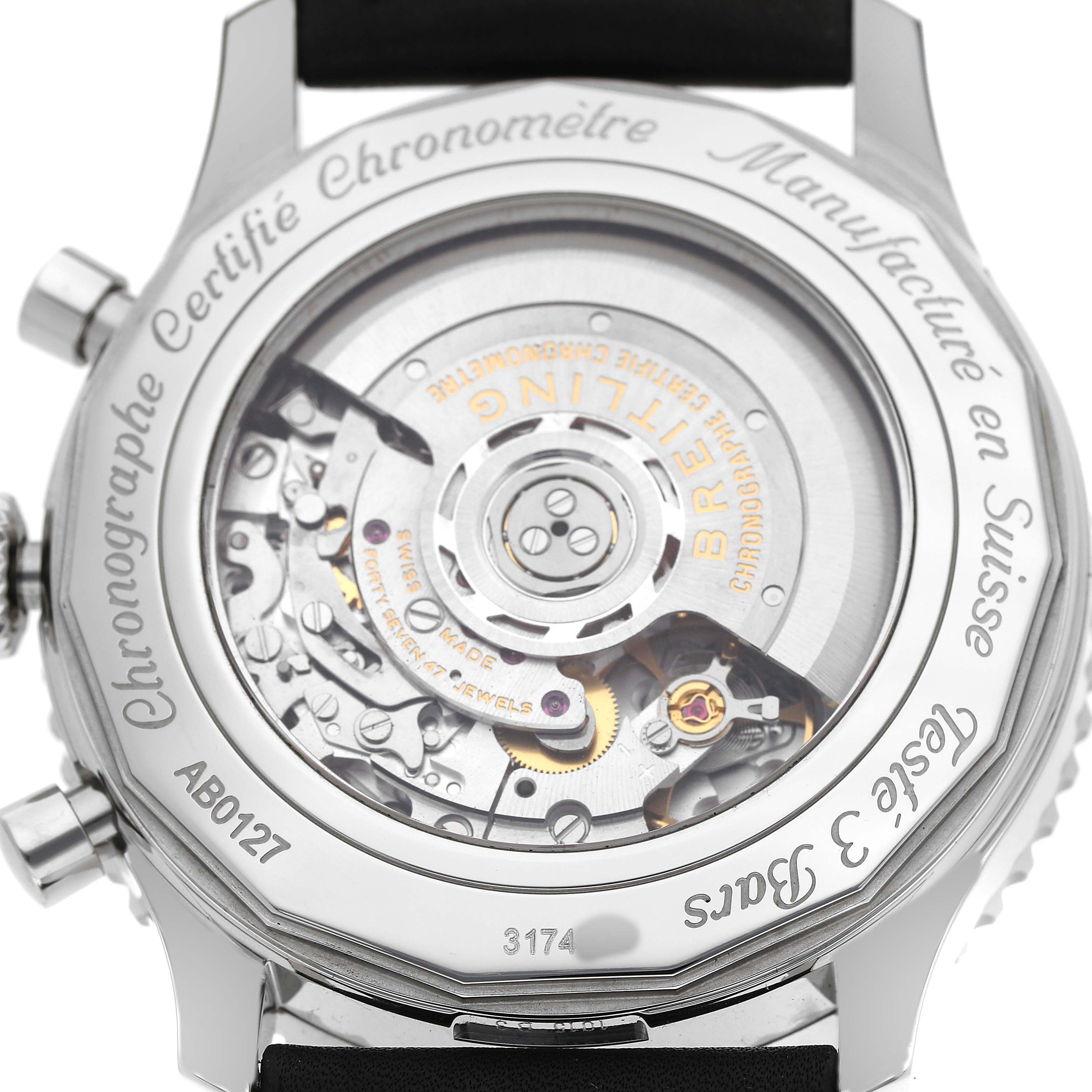 The image shows the back of a Breitling Navitimer AB0127 Men's Stainless Steel Black Dial watch, highlighting its intricate mechanical movement.