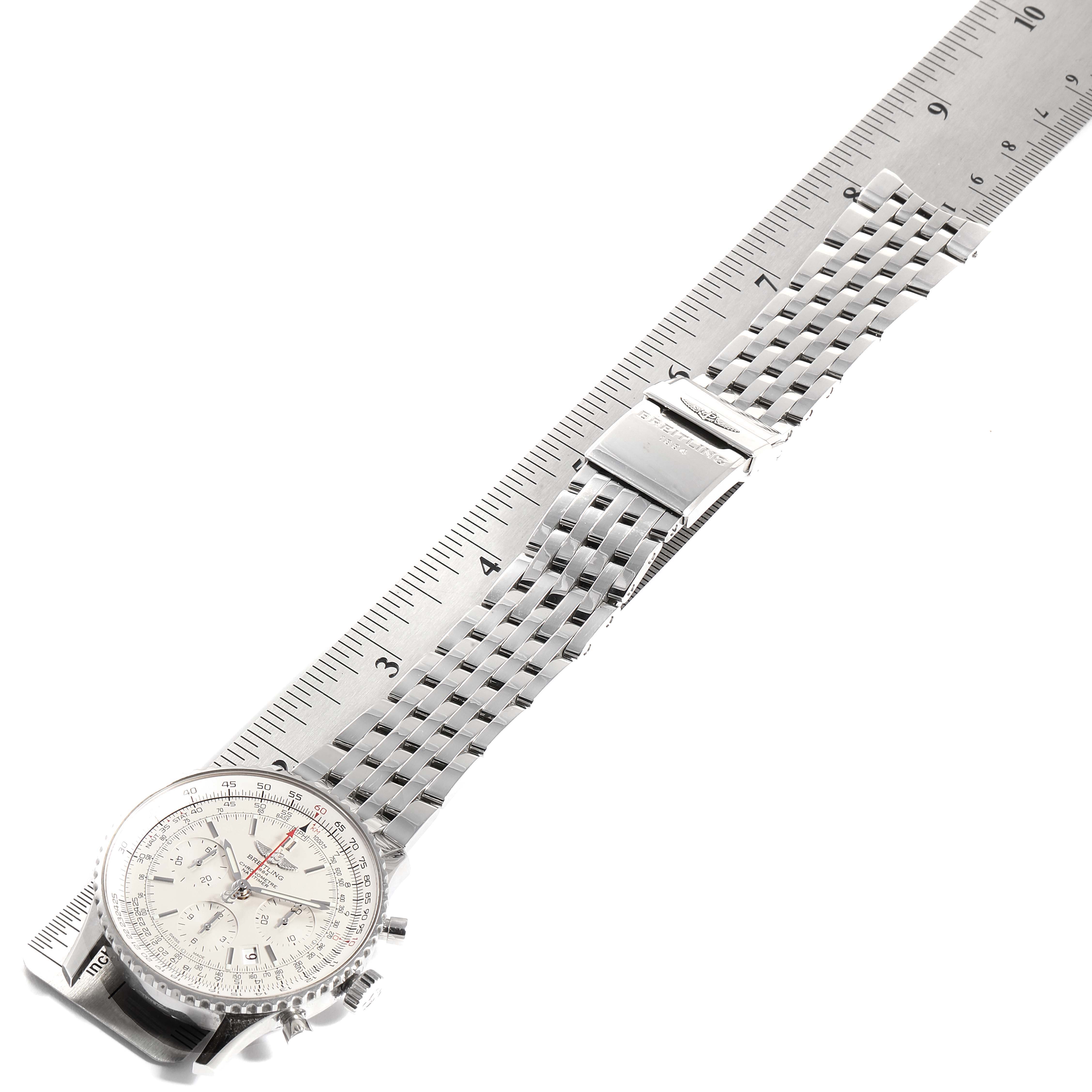 The image shows the Breitling Navitimer AB0123 Men's Stainless Steel Silver Dial AB0123 Men's Stainless Steel Silver Dial watch laid flat, highlighting its face and stainless steel bracelet next to a ruler for scale.