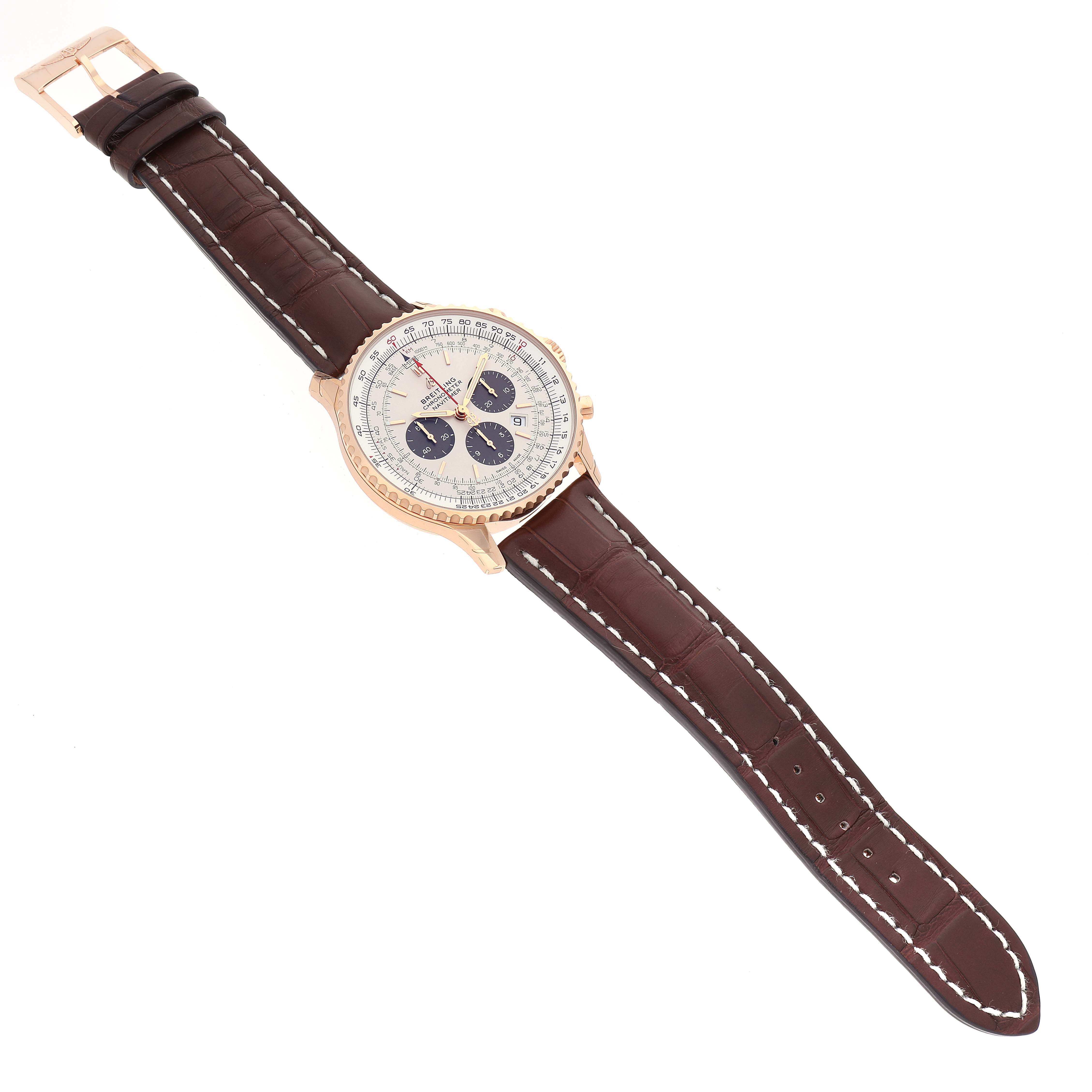 This image shows a Breitling Navitimer RB0127 Men's Rose Gold Silver Dial RB0127 Men's Rose Gold Silver Dial watch at a slight angle, emphasizing its face, brown leather strap, and gold case.