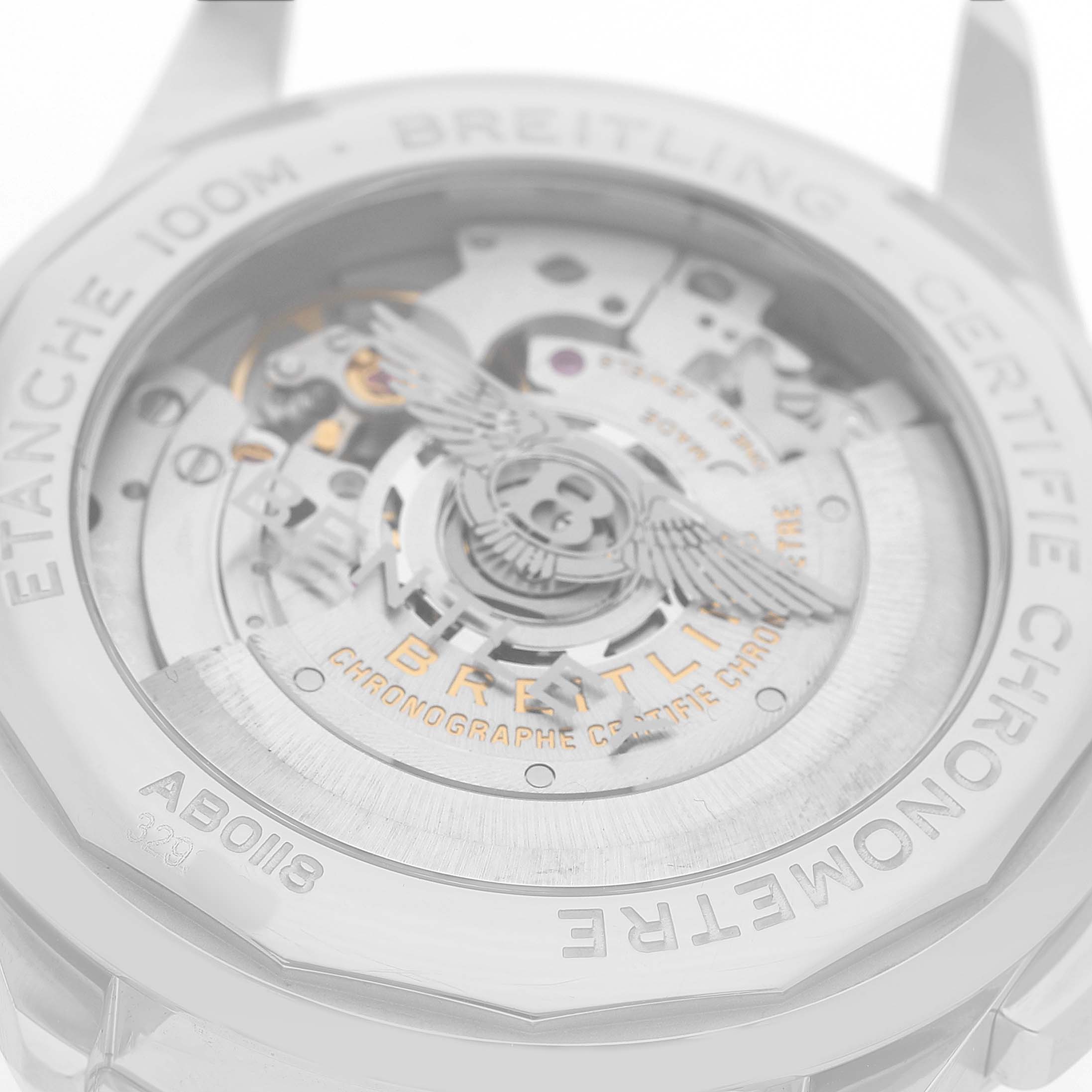 The image shows the back of a Breitling Premier AB0118 Men's Stainless Steel Green Dial watch, highlighting the movement and engraved details.