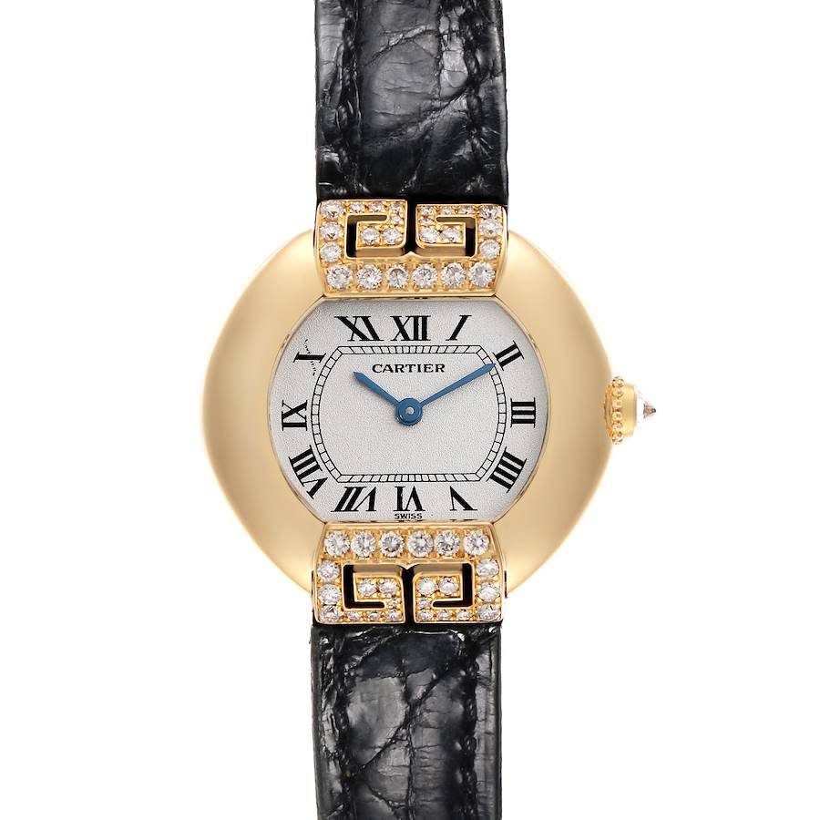 The Cartier Tortue watch is shown from a top-down angle, displaying the dial, case, and leather strap.