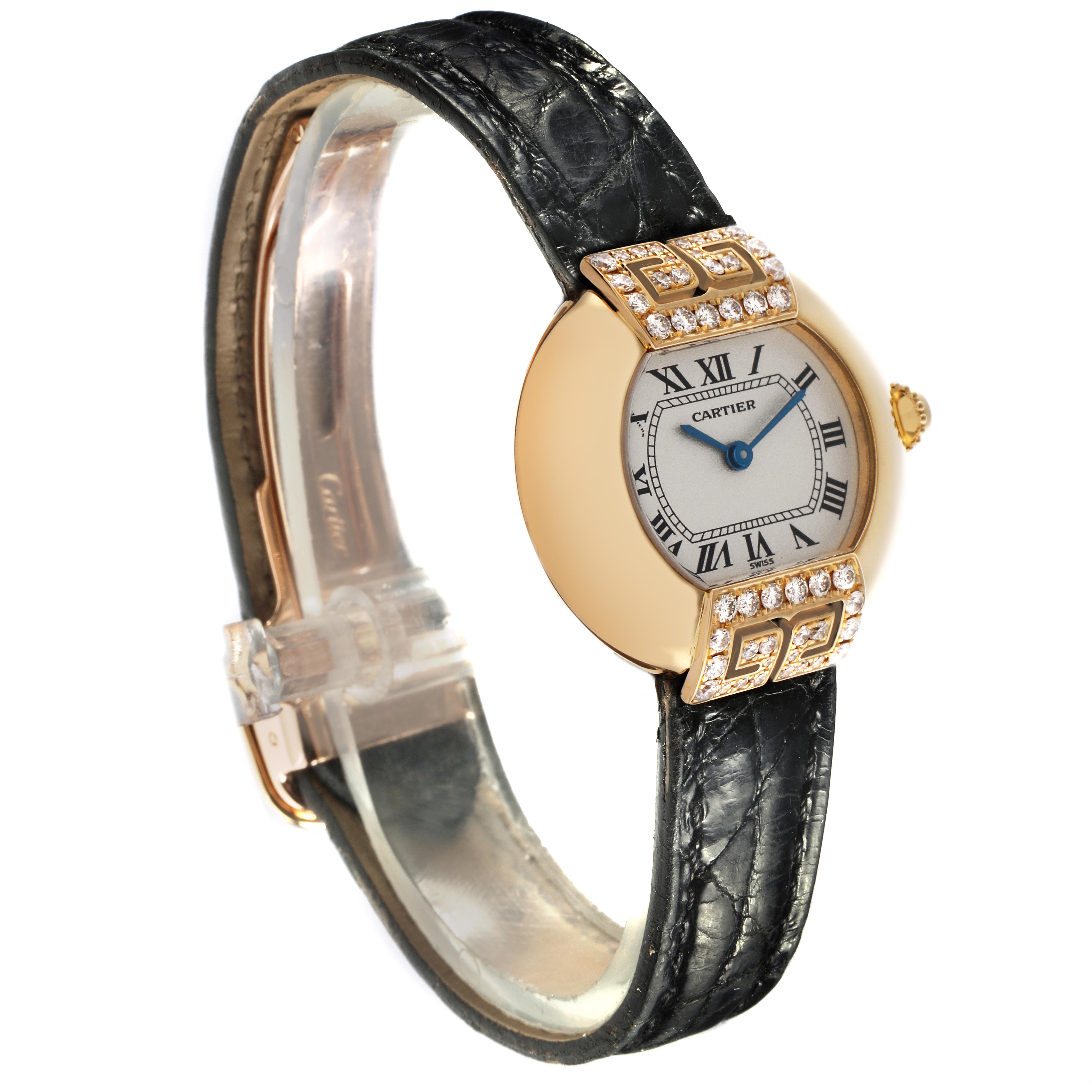 The Cartier Tortue WB600851 Women
s Yellow Gold Silver Dial WB600851 Women
s Yellow Gold Silver Dial watch is shown at a side-angle, displaying the face, strap, and diamond-set bezel.