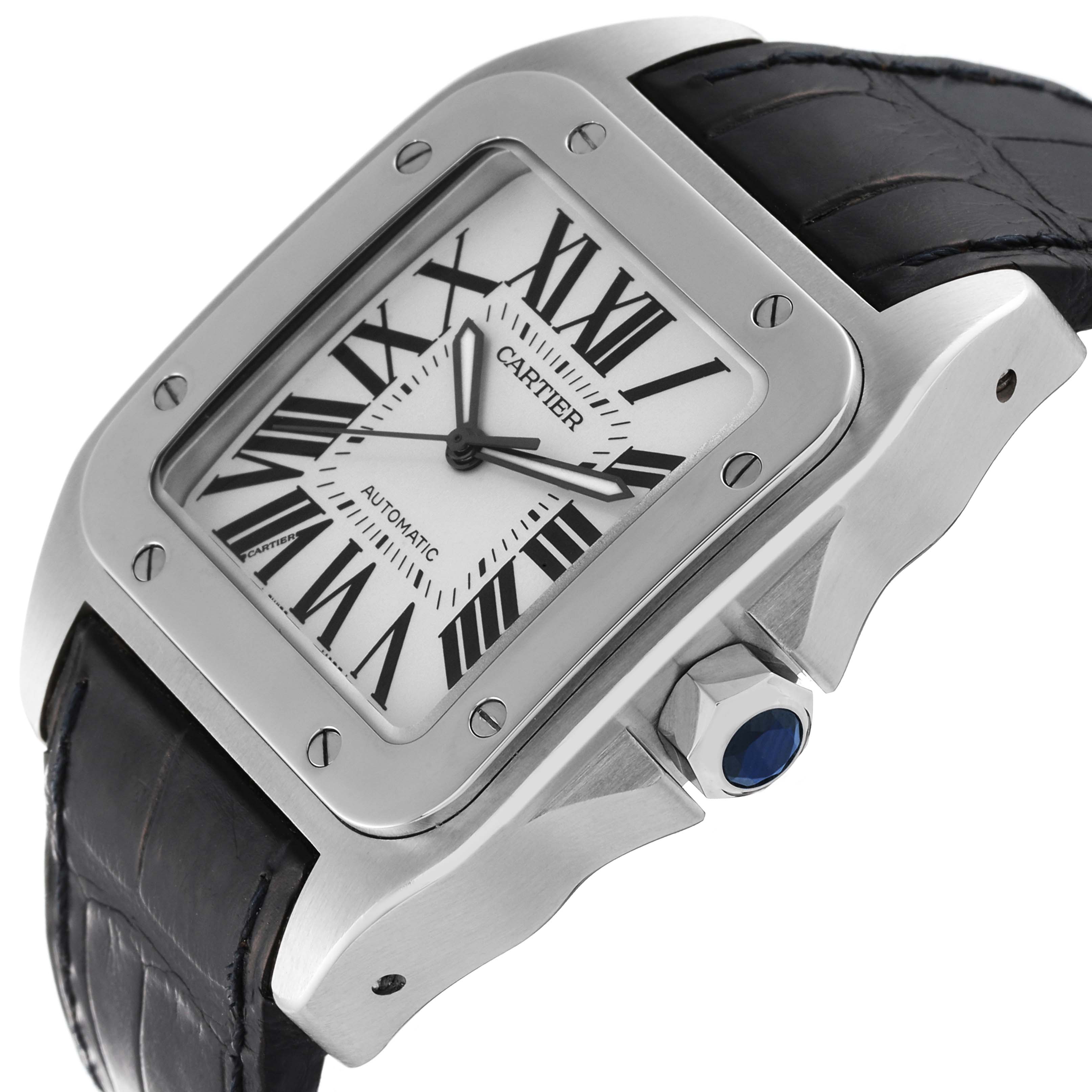 The image shows a Cartier Santos W20073X8 Men
s Stainless Steel Silver Dial W20073X8 Men
s Stainless Steel Silver Dial model watch at an angle highlighting its face, bezel, crown, and leather strap.