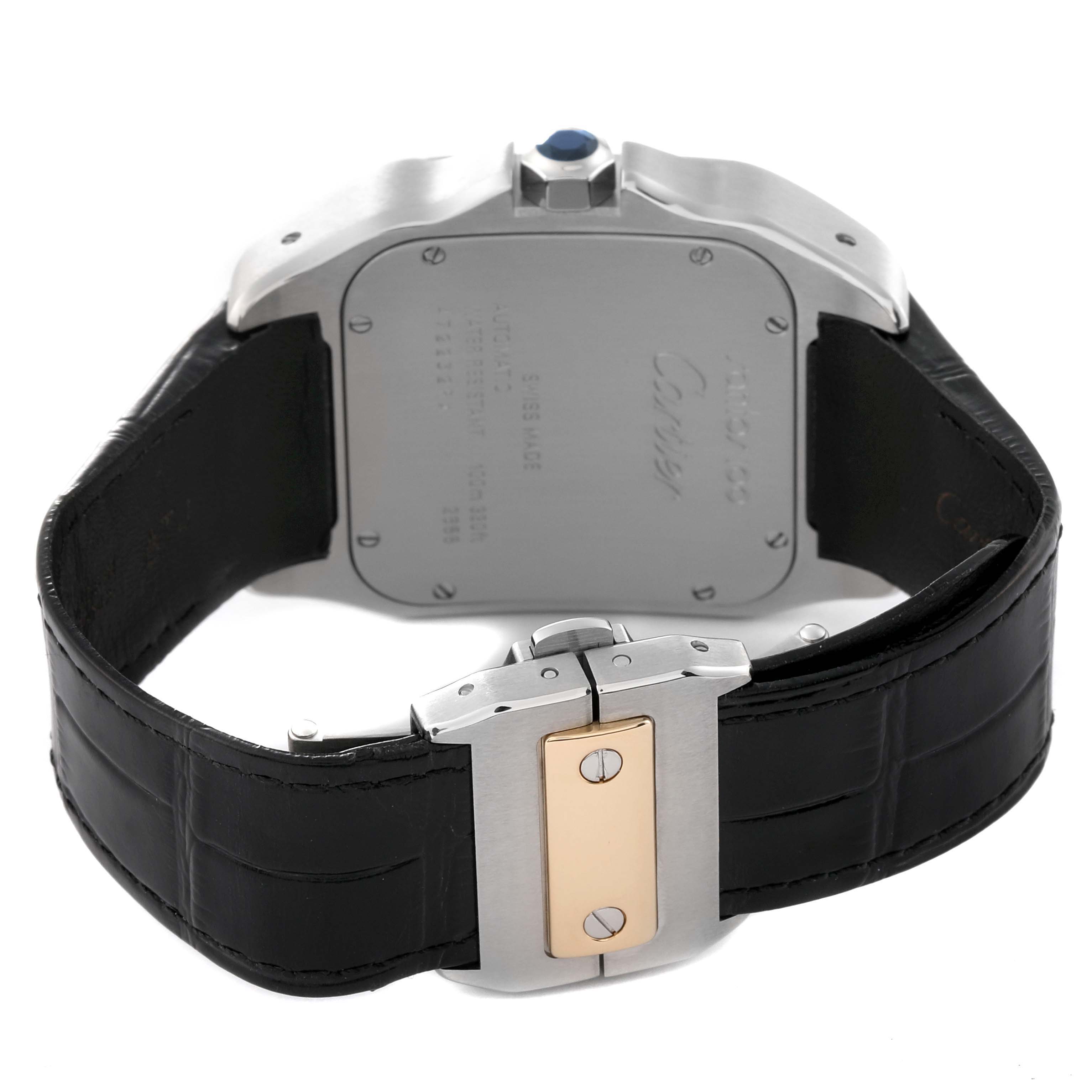 The image shows the back and clasp of a Cartier Santos W20072X7 Men's Steel and Gold (two tone) Silver Dial W20072X7 Men's Steel and Gold (two tone) Silver Dial watch, highlighting the leather strap and metal caseback.