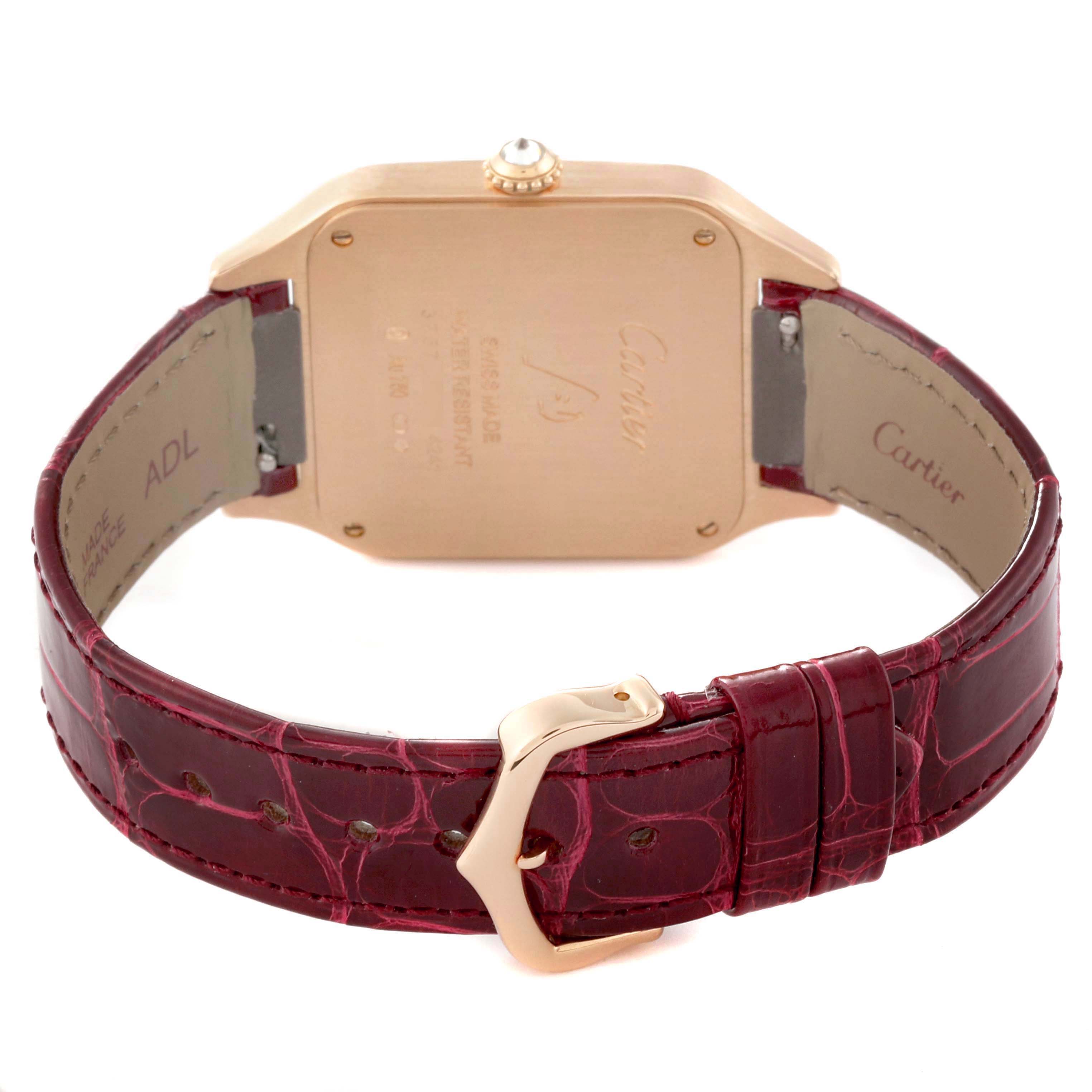 The Cartier Santos WJSA0016 Women's Rose Gold Silver Dial watch is shown from the back, highlighting the case back, crown, and burgundy leather strap with buckle.