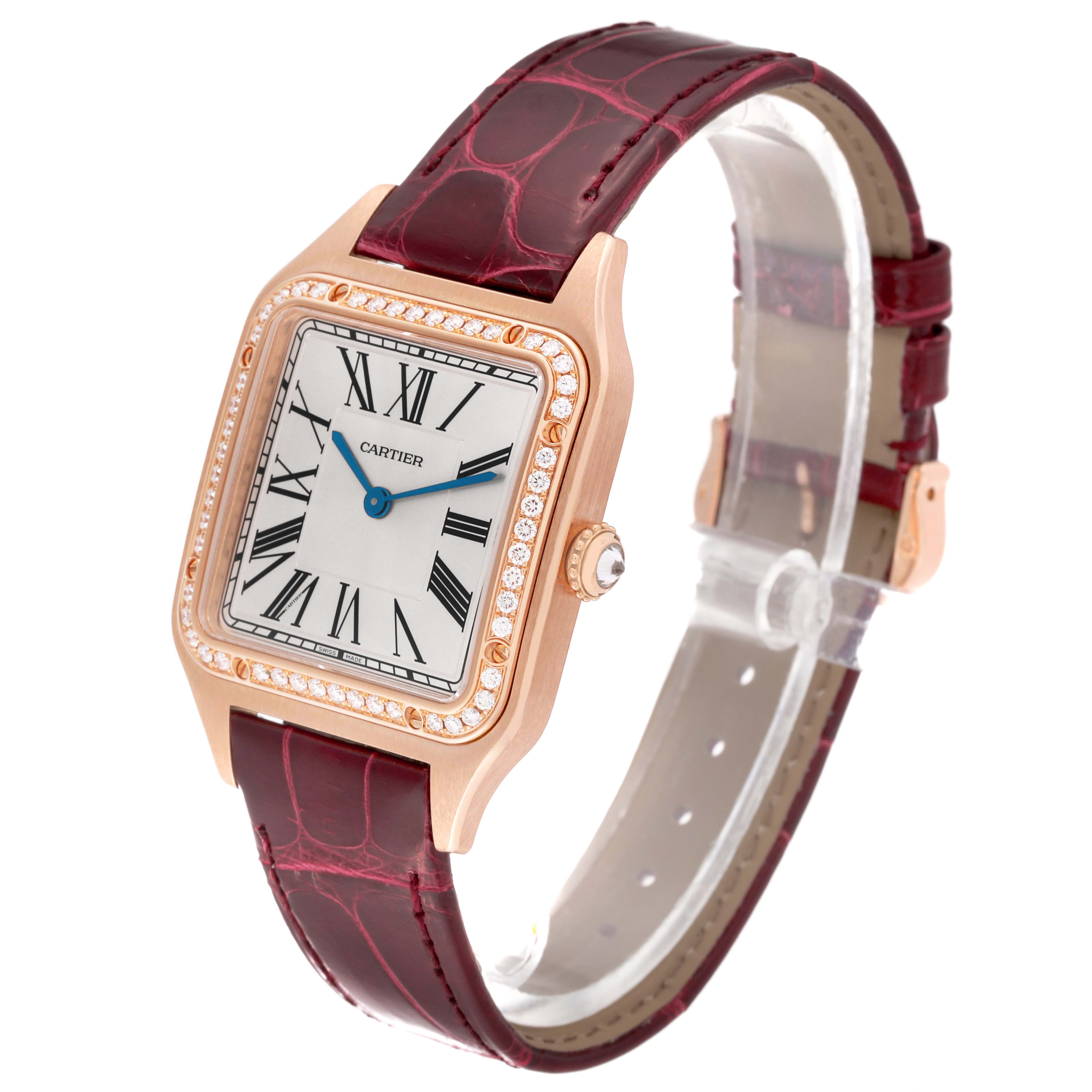 The Cartier Santos WJSA0016 Women's Rose Gold Silver Dial watch is shown from an oblique angle, featuring its face, bezel, strap, and crown.