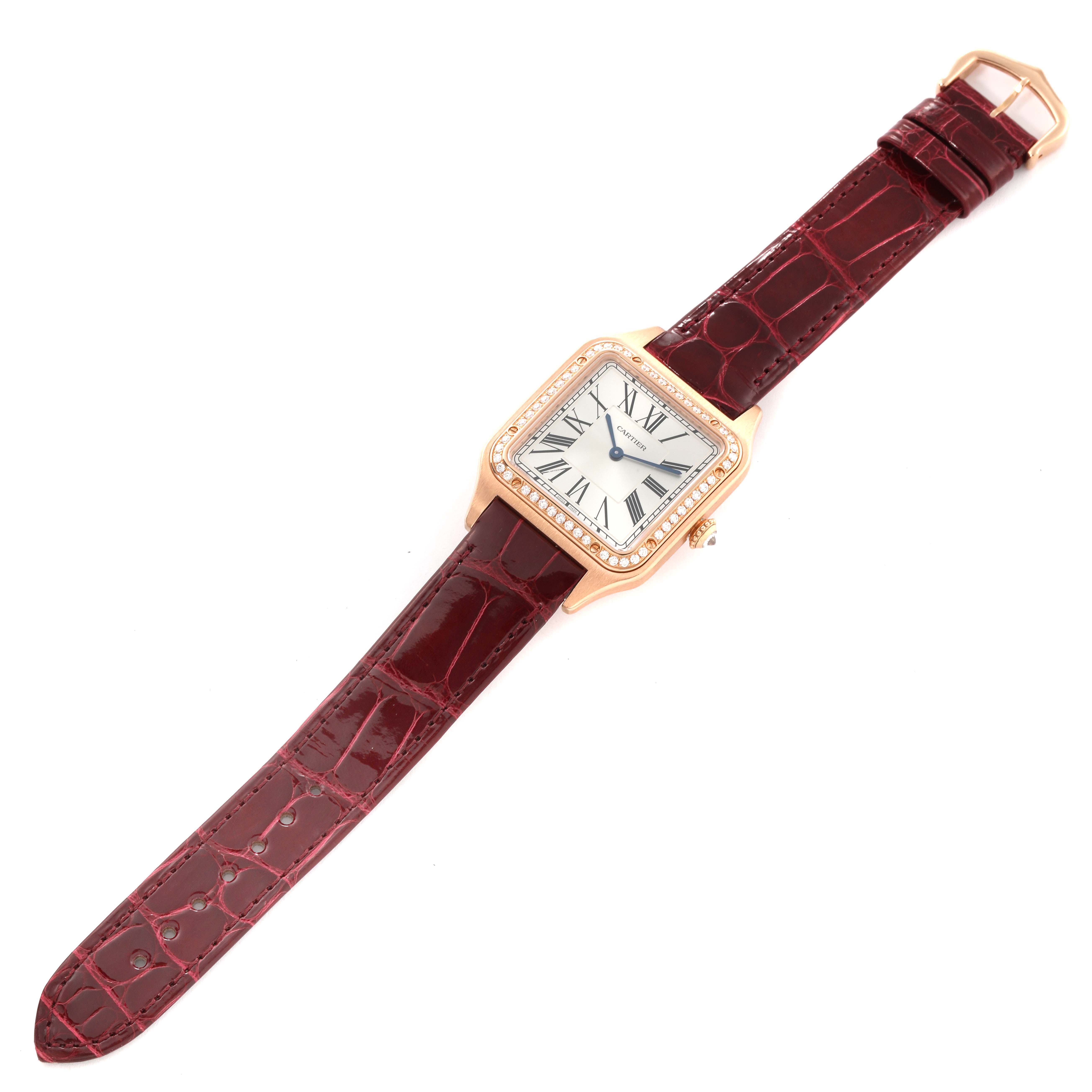 The Cartier Santos WJSA0016 Women's Rose Gold Silver Dial WJSA0016 Women's Rose Gold Silver Dial watch is shown from a top-down angle, displaying the face, bezel, and full leather strap.