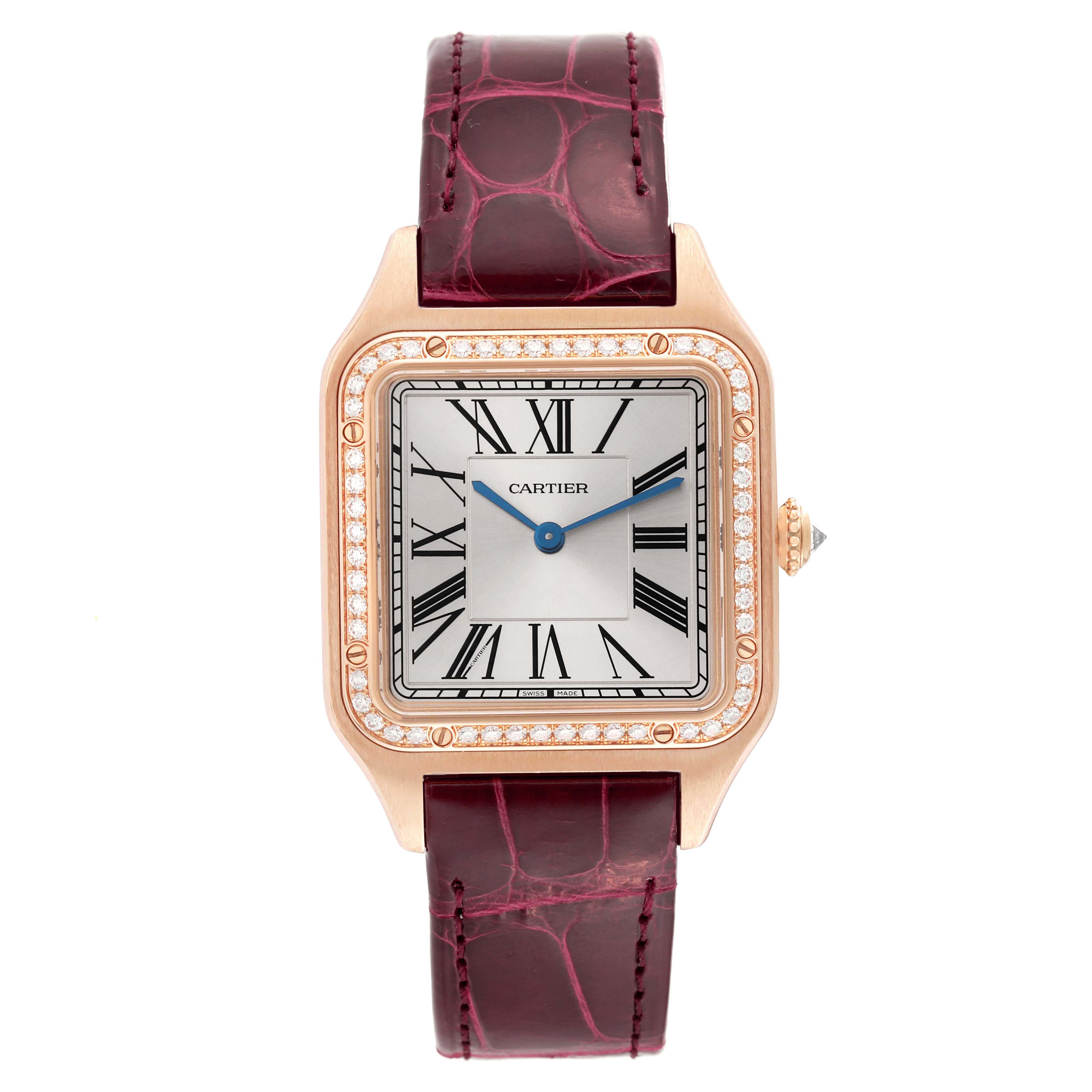 The Cartier Santos WJSA0016 Women's Rose Gold Silver Dial watch is shown from a top-down angle, highlighting the face, bezel with diamonds, and burgundy strap.