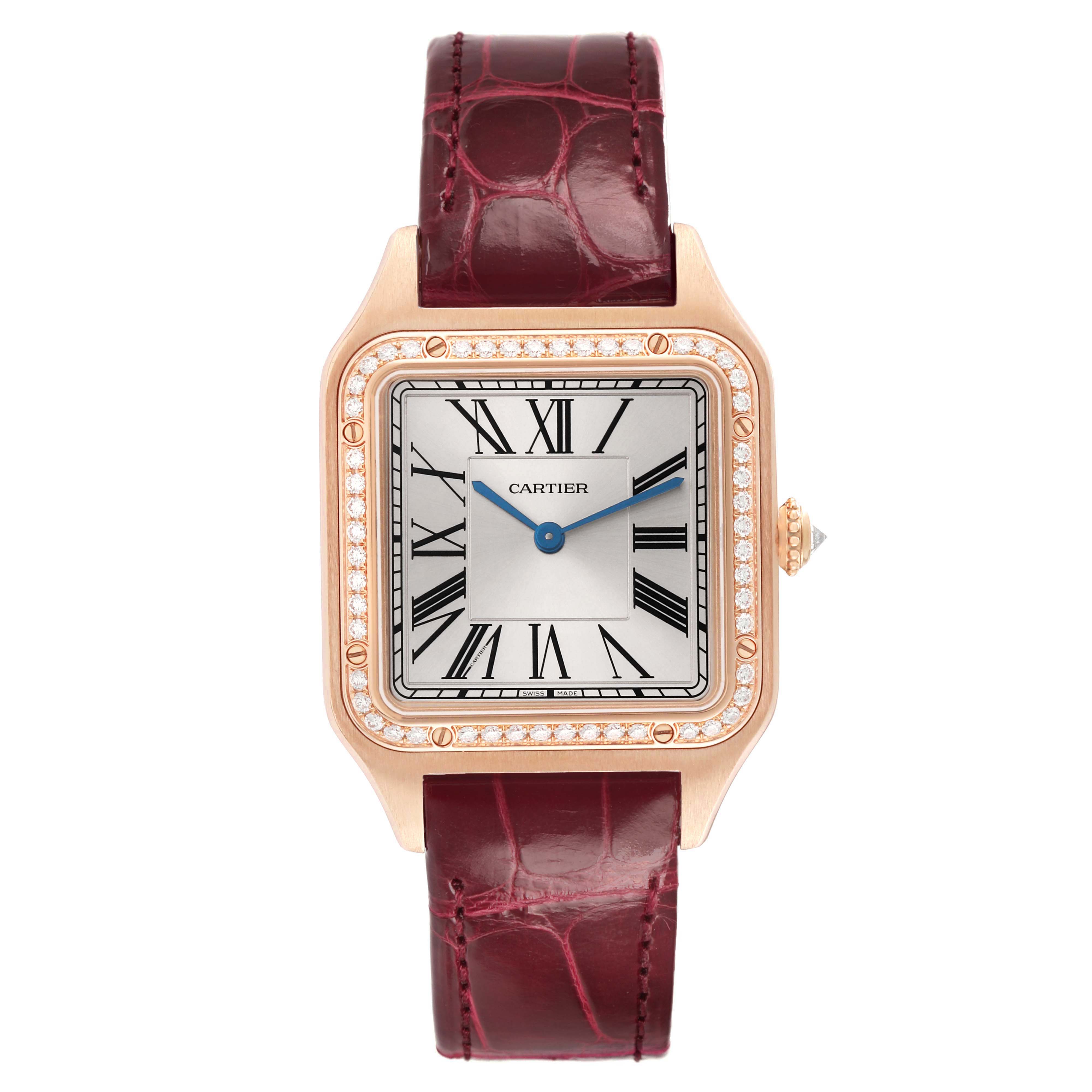 The Cartier Santos WJSA0016 Women's Rose Gold Silver Dial watch is shown from the front, featuring a square dial, Roman numerals, diamond-set bezel, and a burgundy strap.