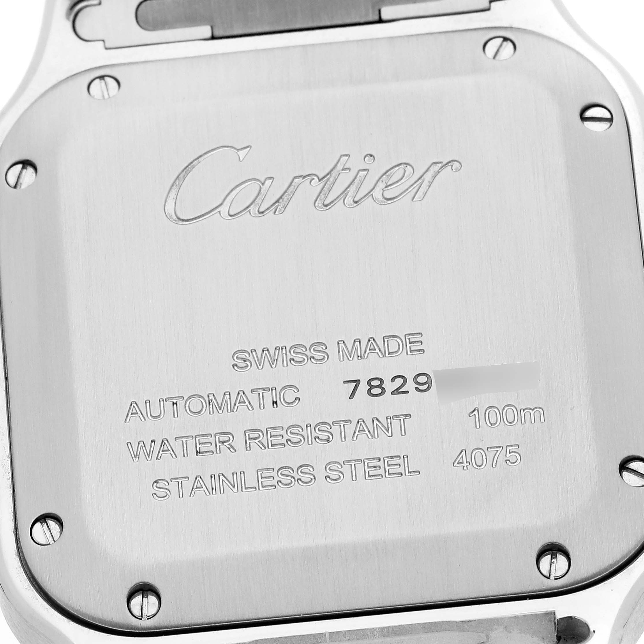 This image shows the back case of a Cartier Santos W2SA0016 Men
s Steel and Gold (two tone) Silver Dial W2SA0016 Men
s Steel and Gold (two tone) Silver Dial watch, highlighting its inscriptions and screws.