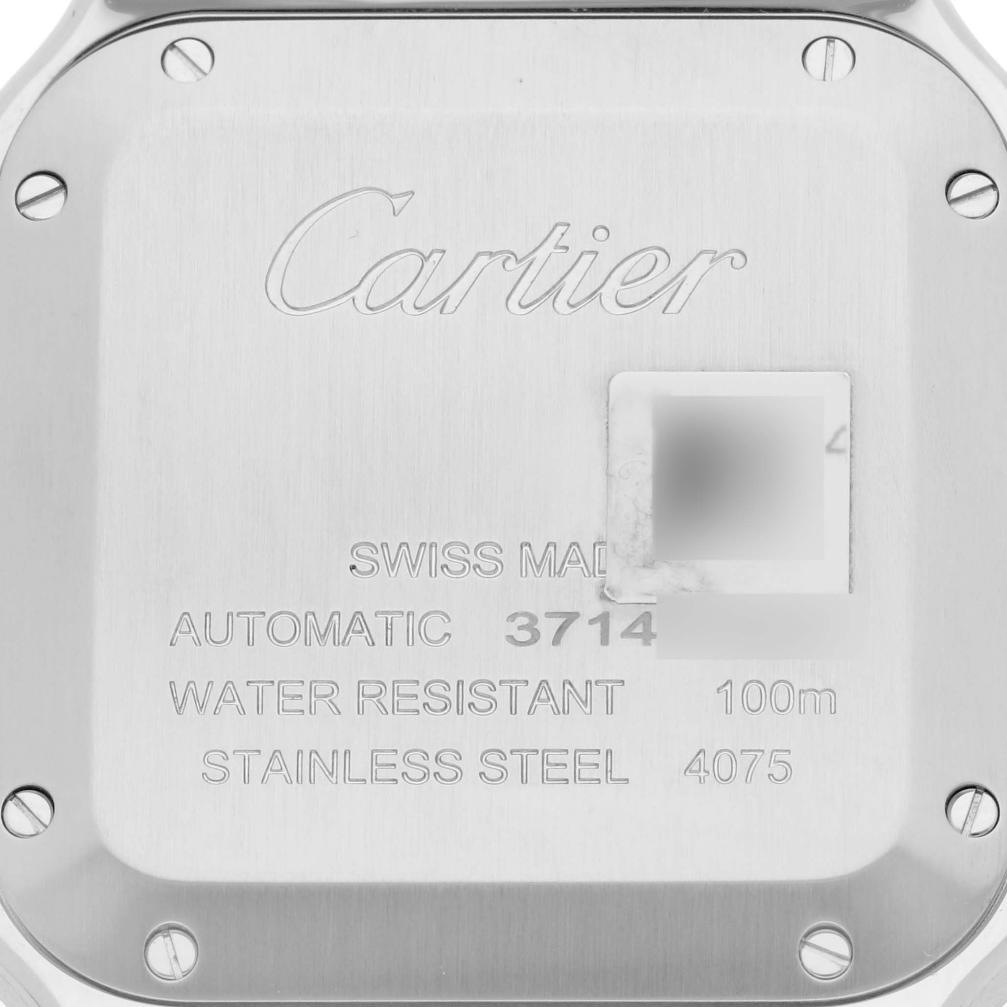This is a close-up shot of the back case of the Cartier Santos WSSA0029 Men
s Stainless Steel Silver Dial WSSA0029 Men
s Stainless Steel Silver Dial watch, showing details like water resistance and model information.