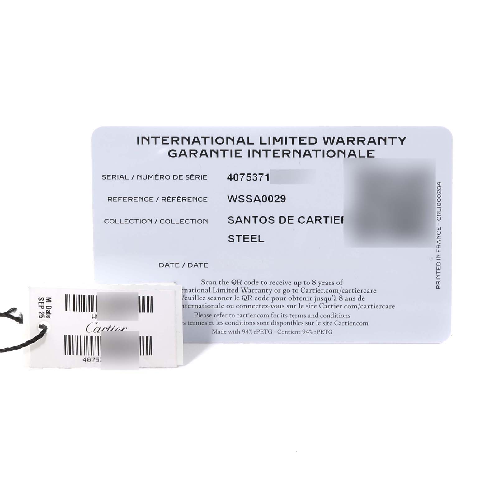 The image shows the warranty card and a tag for the Santos de Cartier watch.
