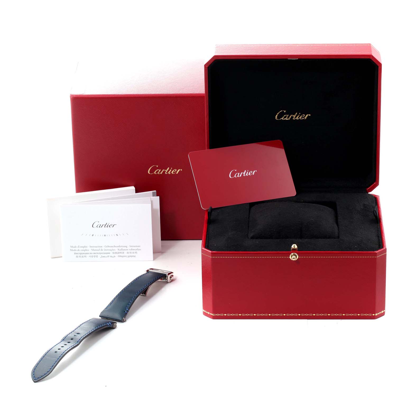 The image shows an opened red Cartier box for a Santos model watch, an extra leather strap, and accompanying documentation.