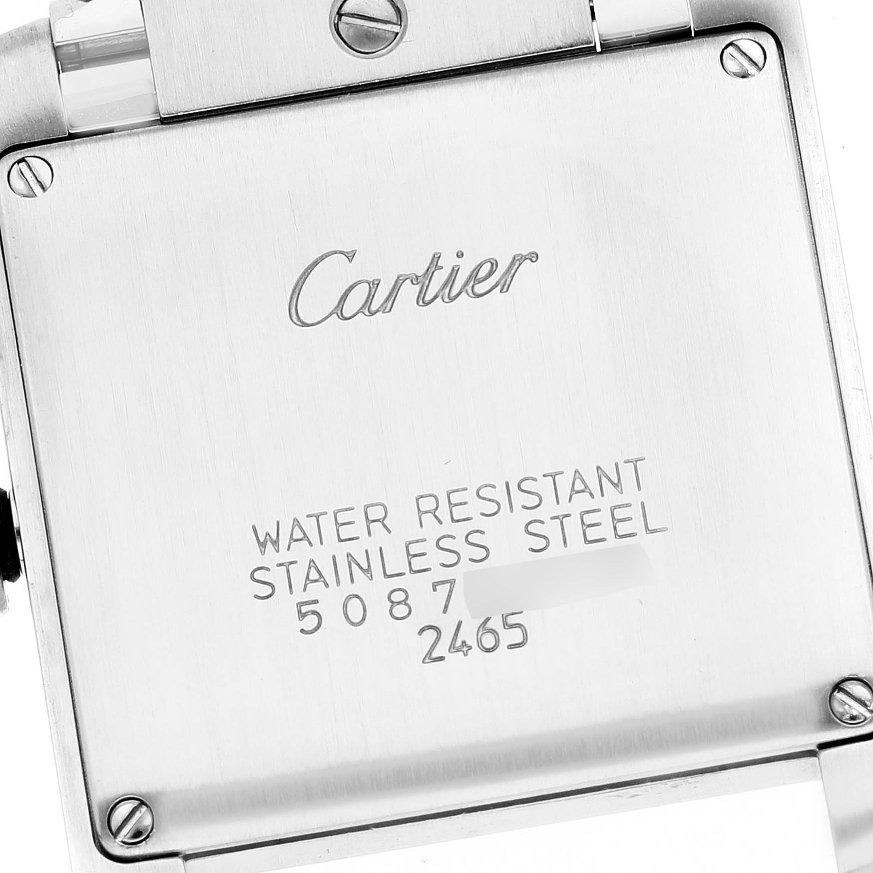 This image shows the back case of a Cartier Tank Française watch, highlighting its water-resistant stainless steel construction.