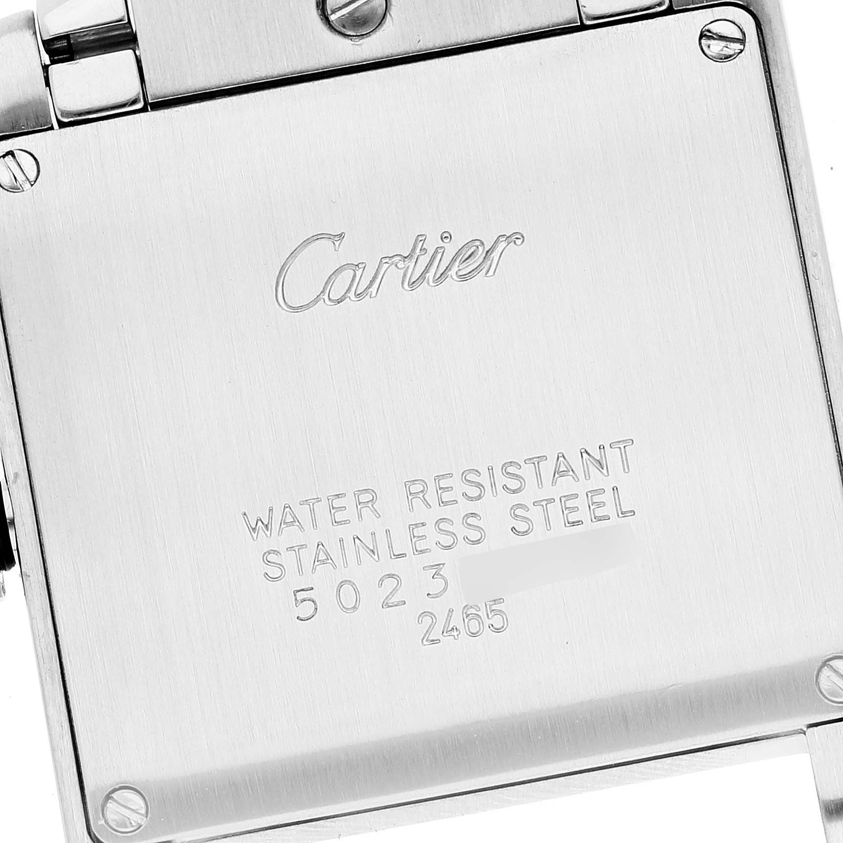 The image shows the back case of a Cartier Tank Francaise W51012Q4 Women's Steel and Gold (two tone) Silver Dial W51012Q4 Women's Steel and Gold (two tone) Silver Dial watch, emphasizing its material and inscriptions.