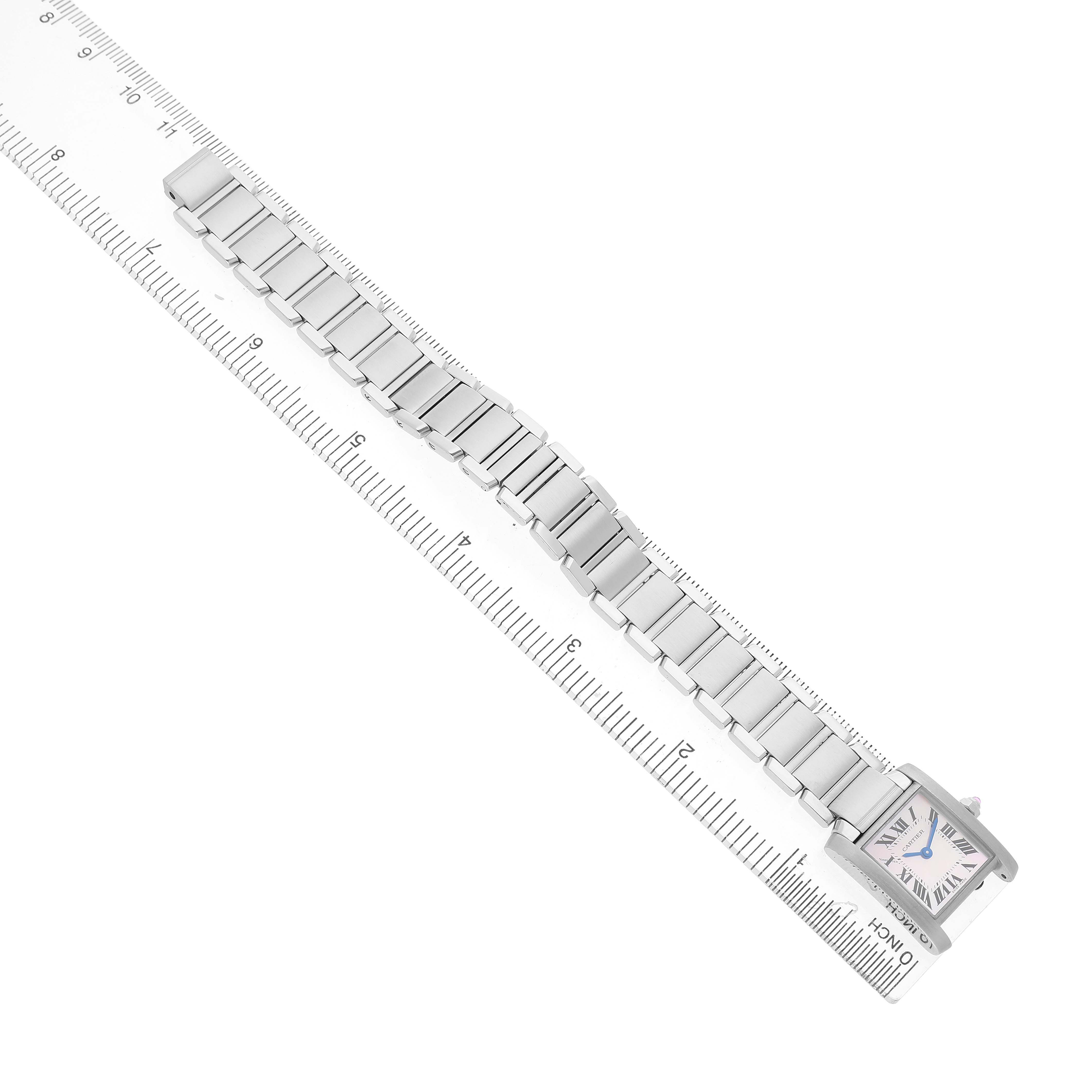 The Cartier Tank Francaise W51028Q3 Women's Stainless Steel Mother of Pearl Dial watch is shown from above, displaying its full metal bracelet and square face on a ruler for size reference.