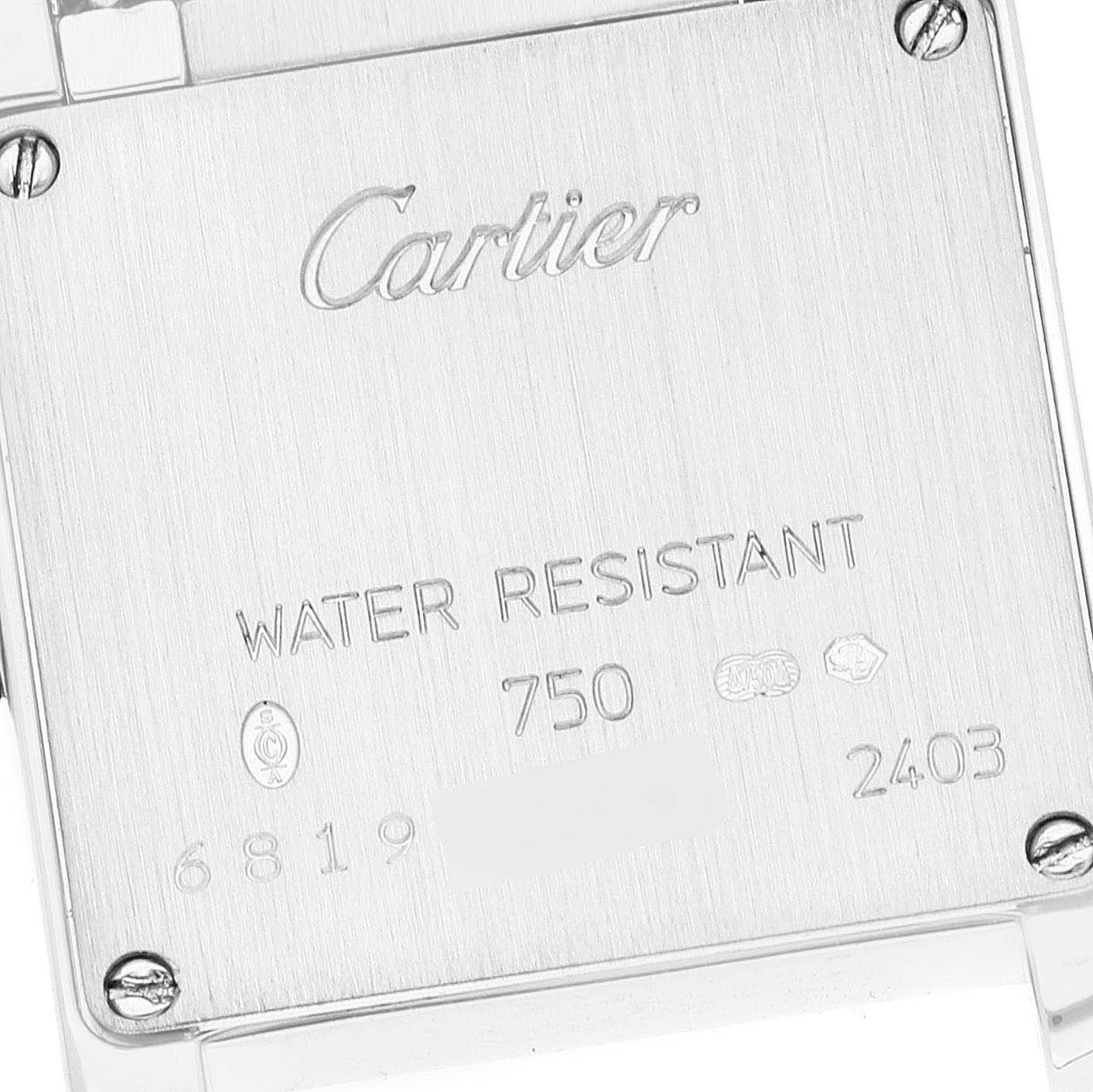 This image shows the back case of the Cartier Tank Francaise WE1002S3 Women's White Gold Silver Dial WE1002S3 Women's White Gold Silver Dial watch, highlighting the brand name, water resistance, and serial numbers.