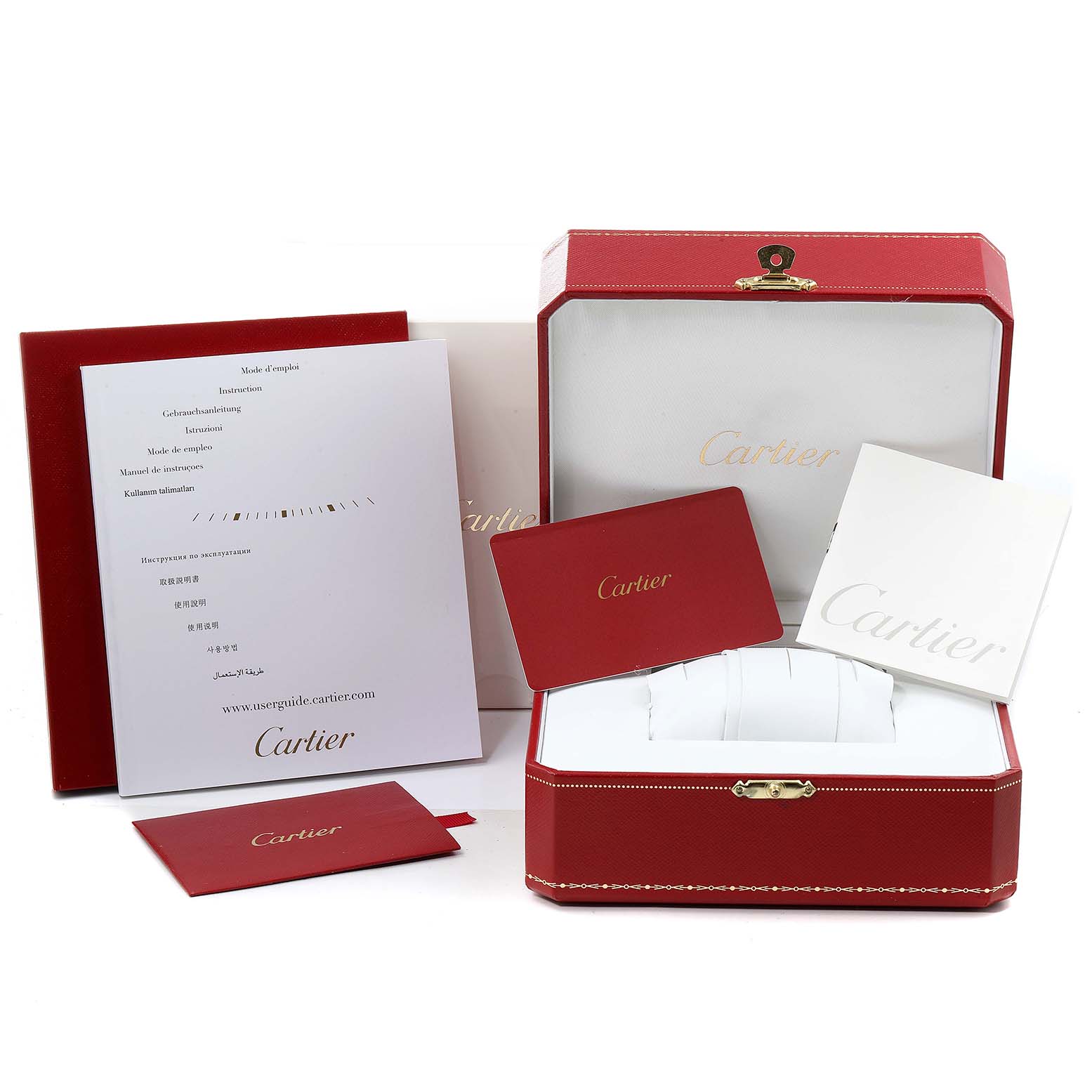 This image shows the packaging and accessories for the Cartier Tank MC WSTA0010 Men's Stainless Steel Blue Dial WSTA0010 Men's Stainless Steel Blue Dial watch, including the box, manuals, and certificate.