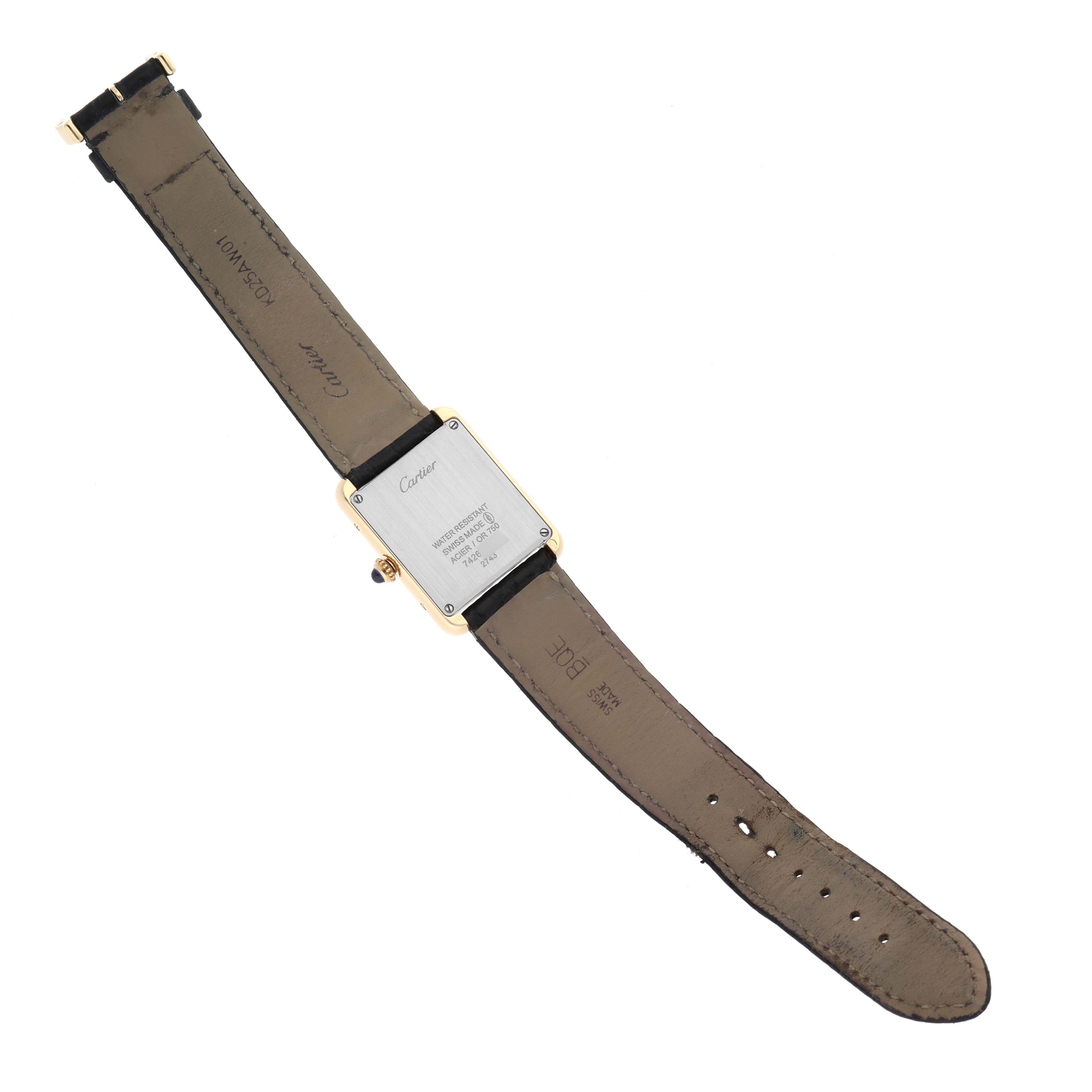 The image shows the back view of a Tank Solo model watch by Cartier, revealing the strap and caseback.