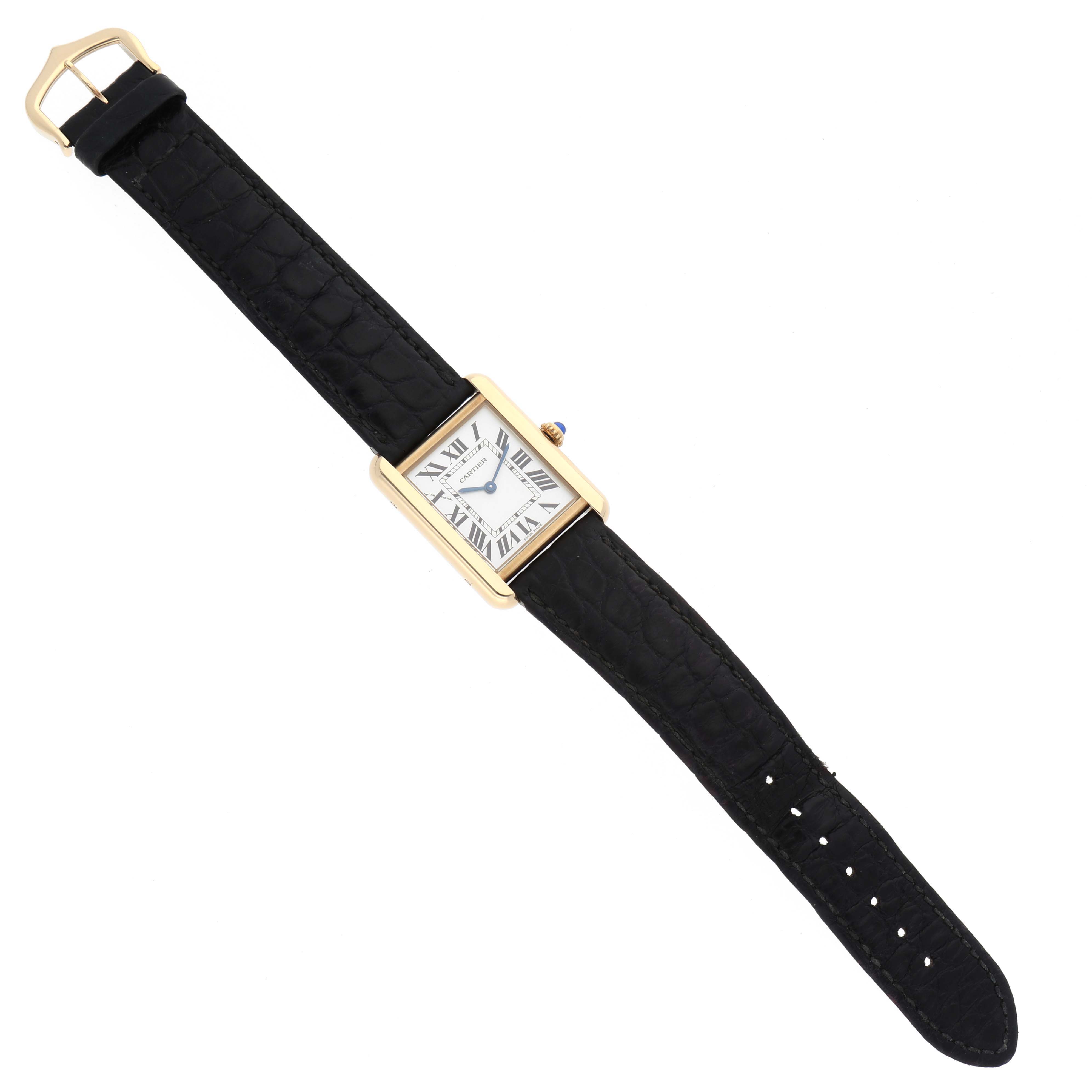 The image shows a top view of a Cartier Tank Solo W1018755 Women
s Steel and Gold (two tone) Silver Dial W1018755 Women
s Steel and Gold (two tone) Silver Dial watch featuring a rectangular dial and a black leather strap.