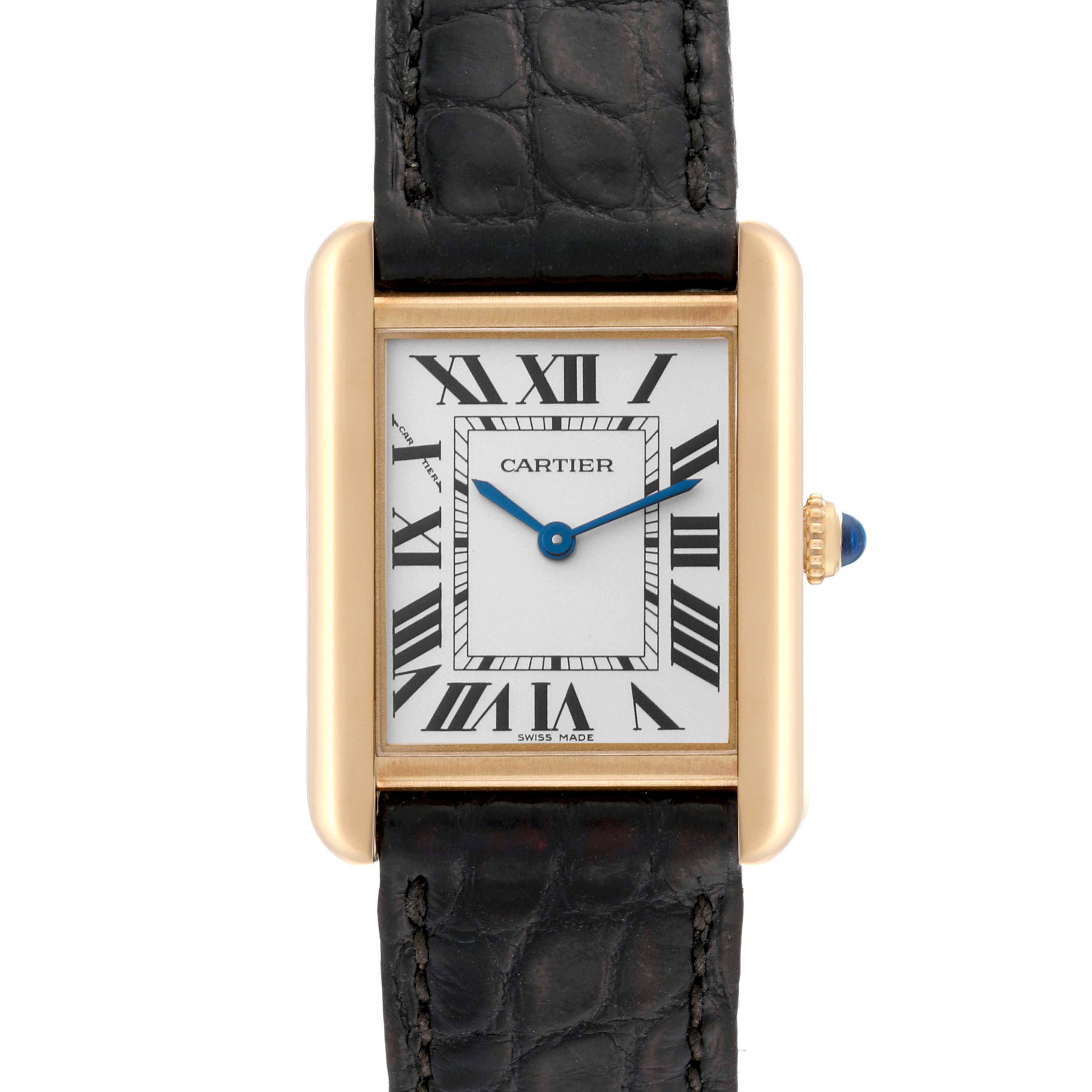 This Tank Solo model watch by Cartier is shown from a top-down angle, featuring its face, strap, and crown with a blue cabochon.