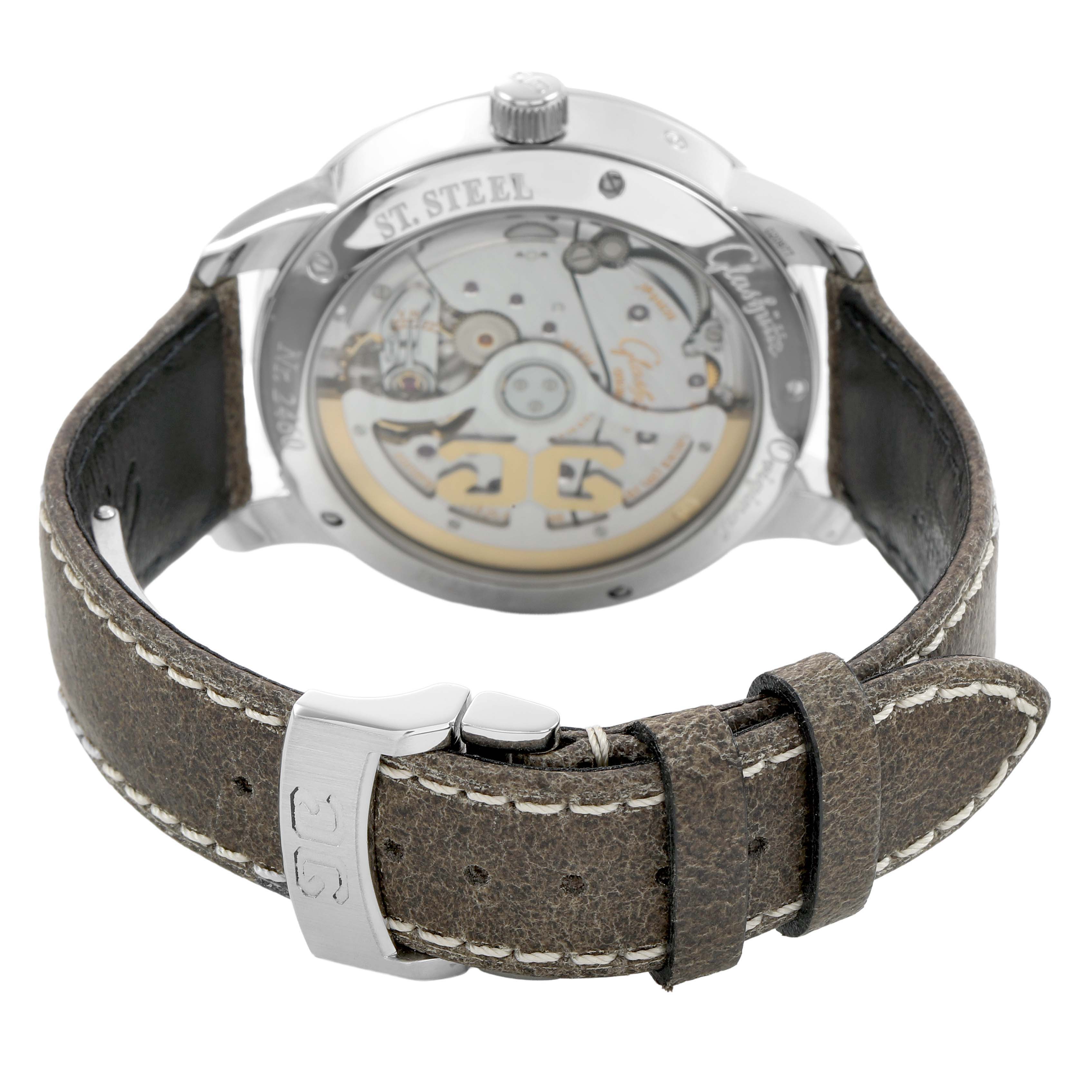 The image shows the back of the Glashutte Original 100-02-13-02-04 Men's Stainless Steel Silver Dial watch, highlighting its movement and brown leather strap.