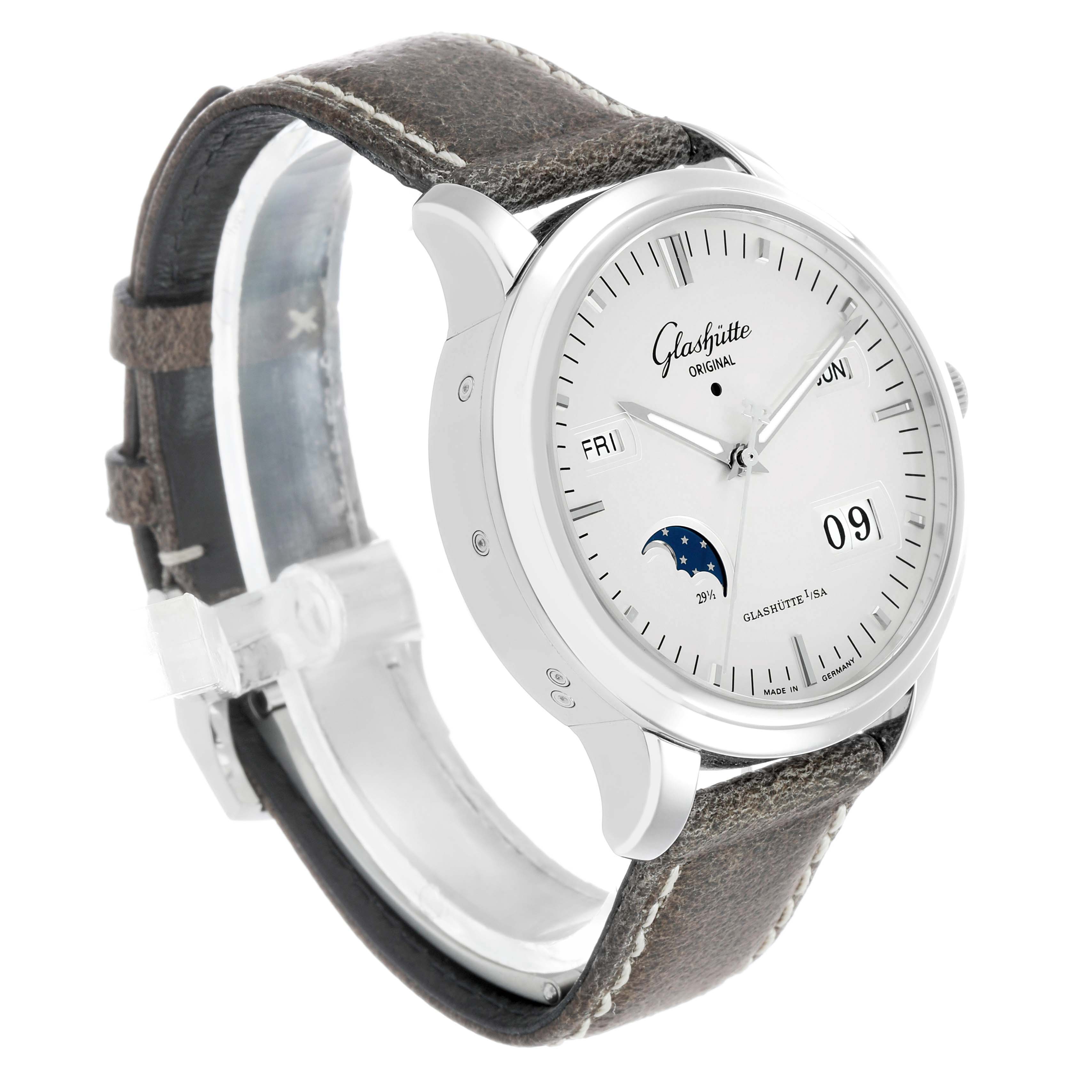 The Glashütte Original watch is shown at a slight angle, displaying the face, leather strap, day, and moon phase features.