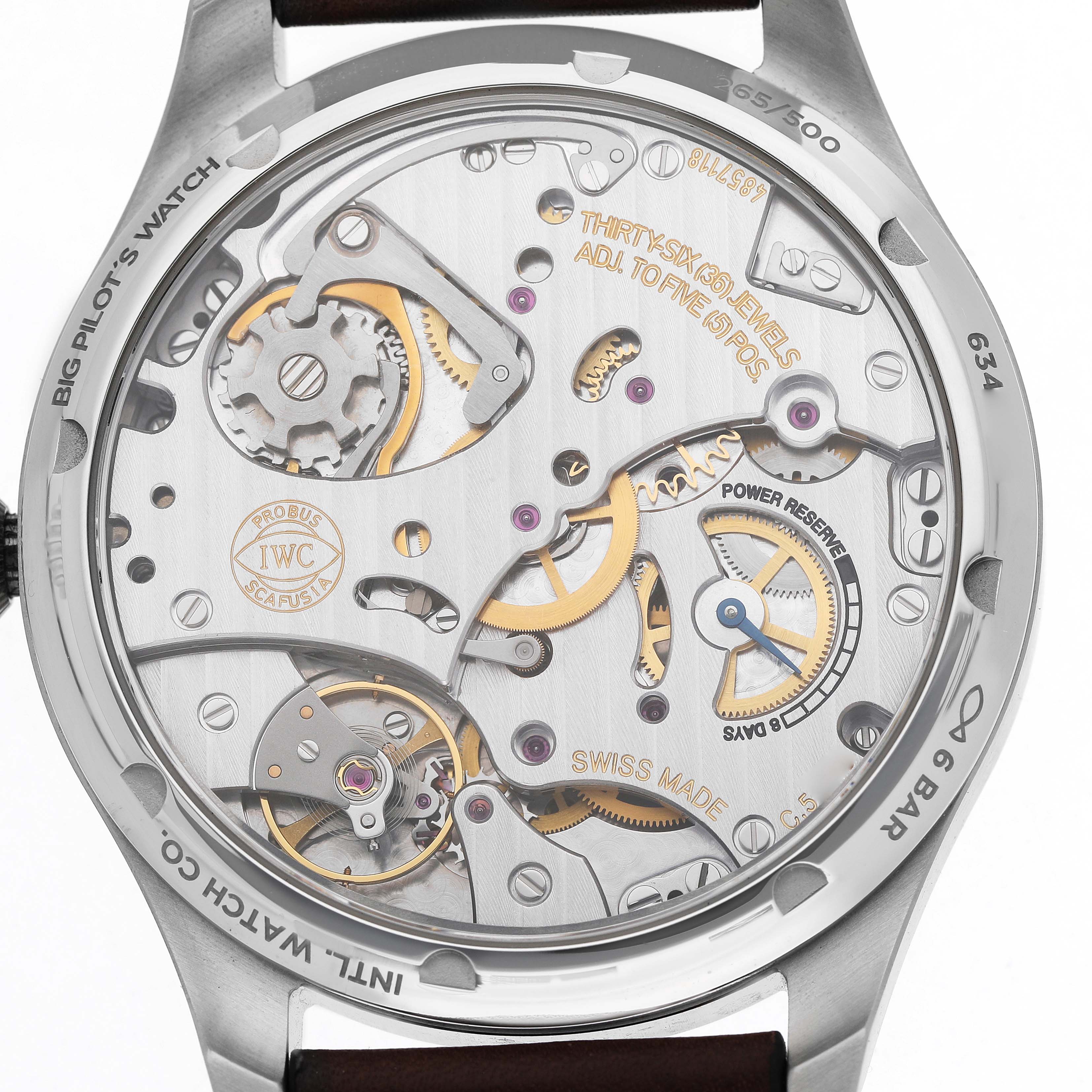 The image shows the back view of the IWC Pilot IW515202 Men's Stainless Steel Blue Dial watch, highlighting its intricate movement and mechanical components.