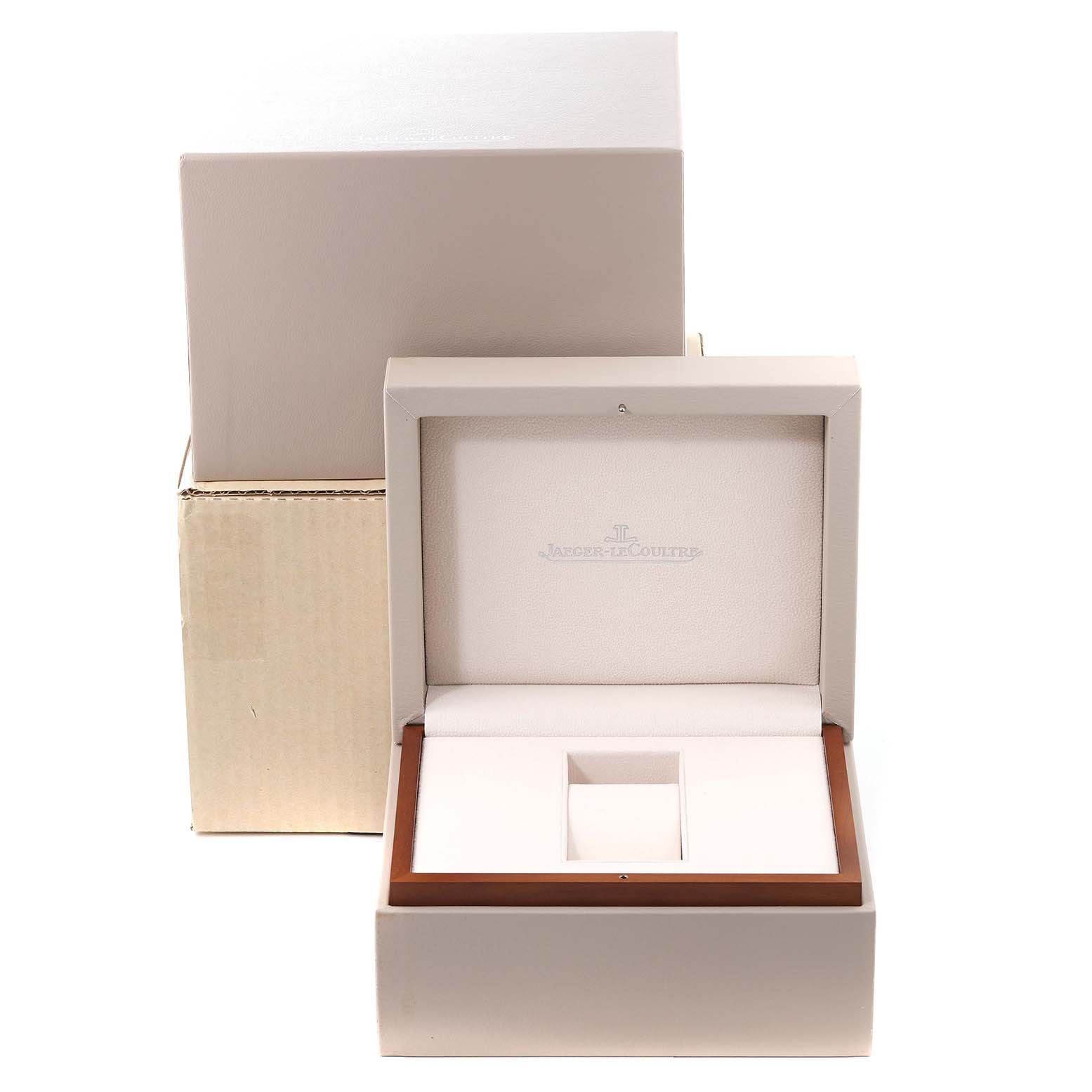 The image shows an empty open box for the Jaeger-LeCoultre Reverso, photographed from a front angle.