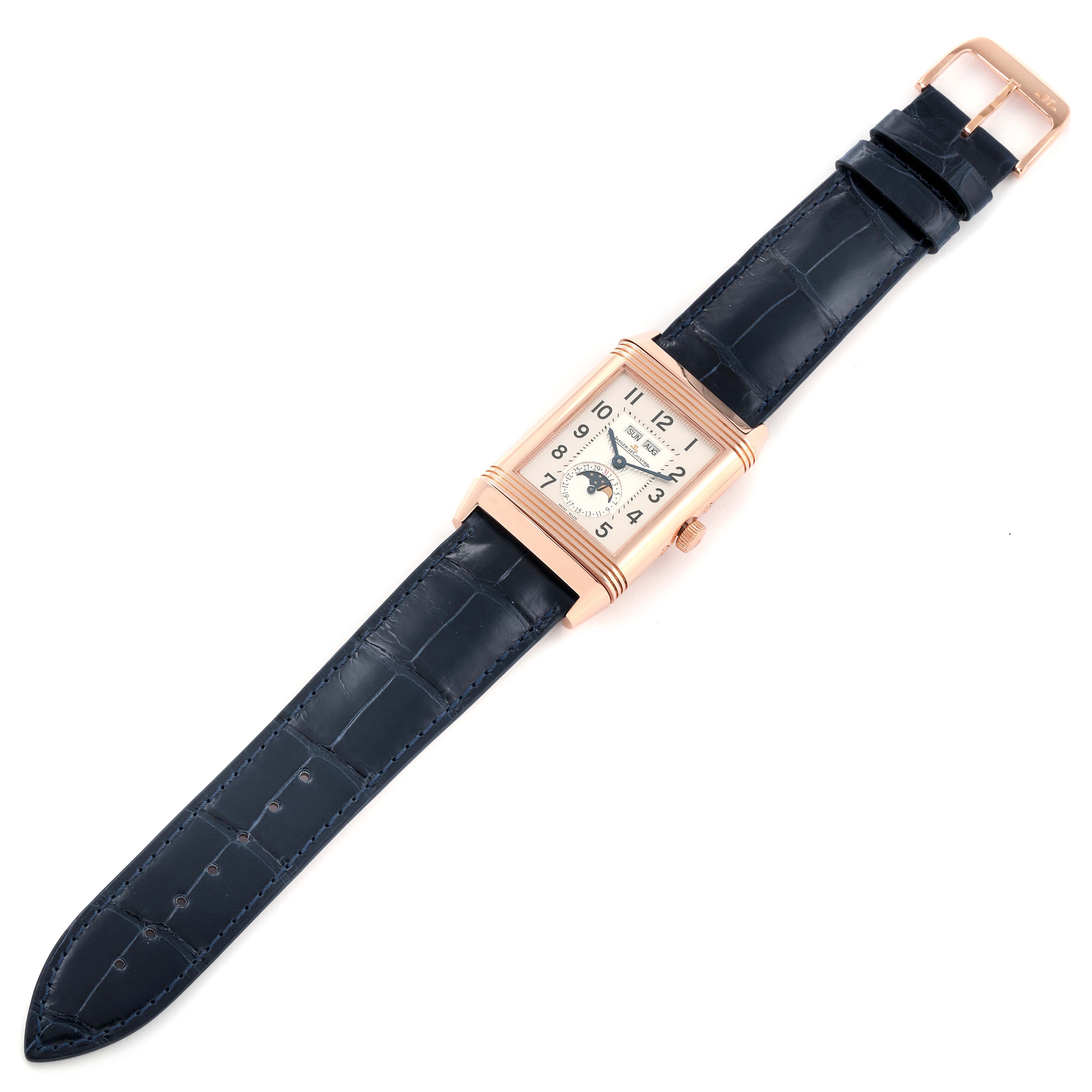 The image displays a Jaeger LeCoultre Reverso Q3752520 Men
s Rose Gold Silver Dial Q3752520 Men
s Rose Gold Silver Dial watch in a top-down angle, showing the face, case, and full strap.