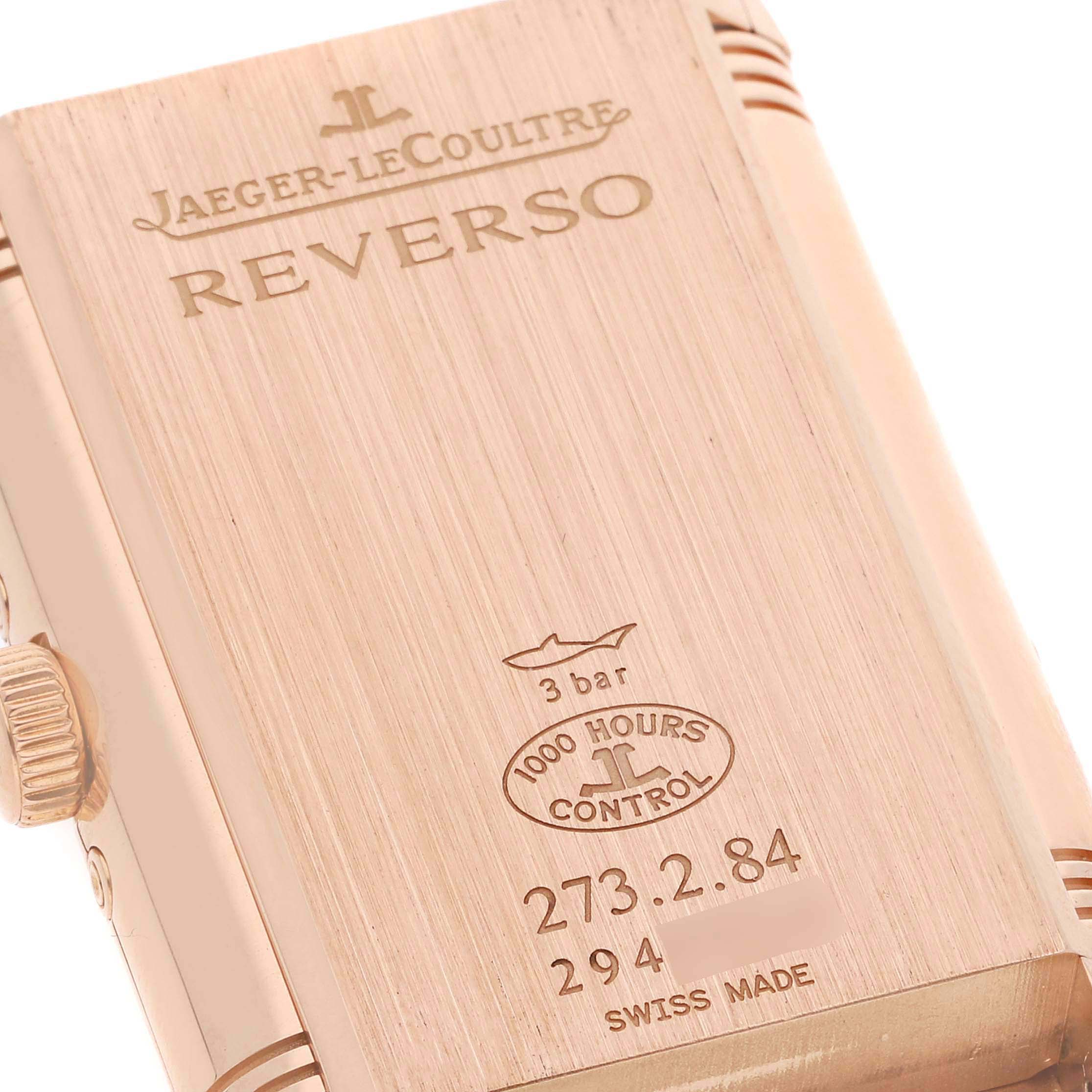 This image shows the back case of a Jaeger-LeCoultre Reverso watch, highlighting its engravings and control seal.