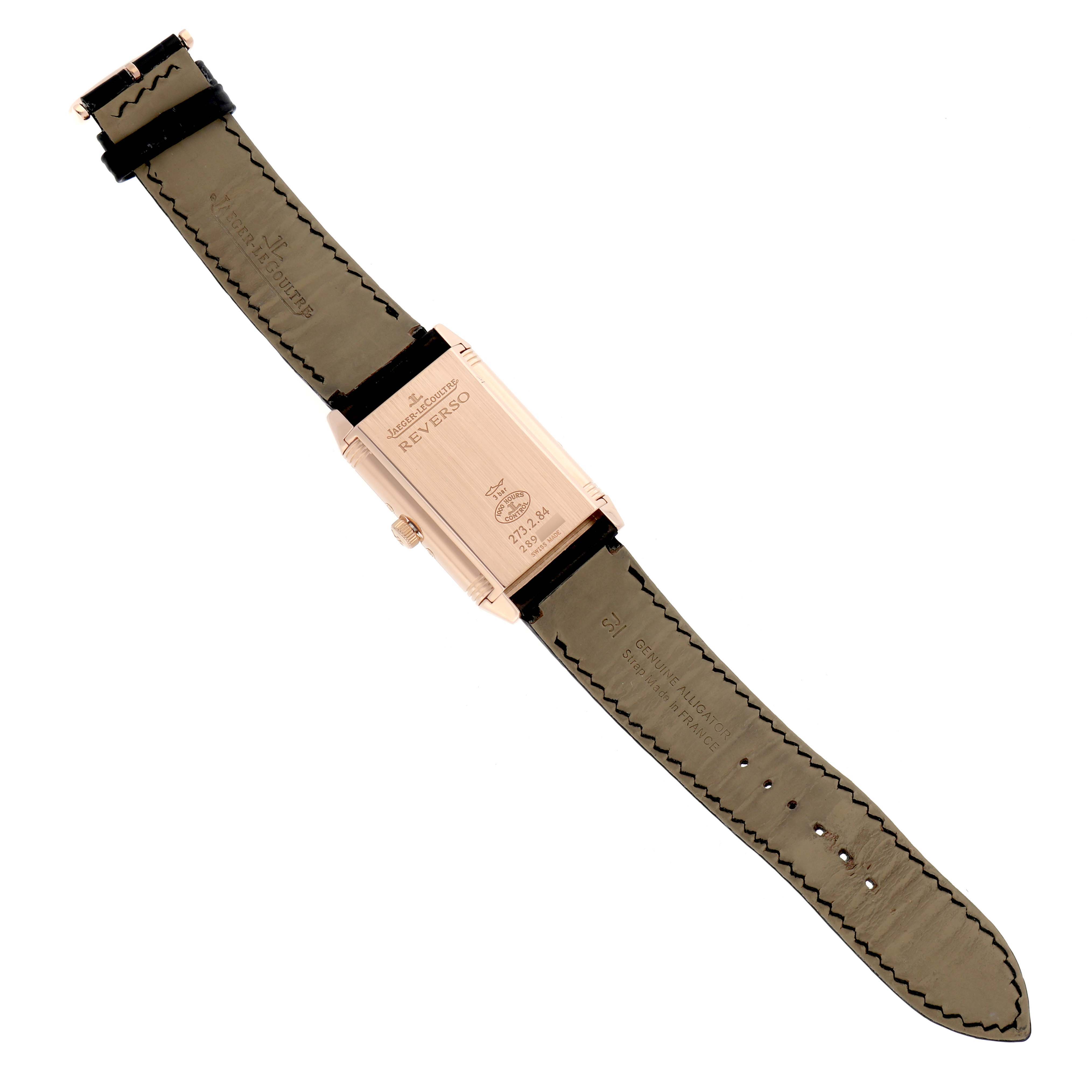 This image shows the back view of a Jaeger-LeCoultre Reverso watch, highlighting the case back and leather strap.