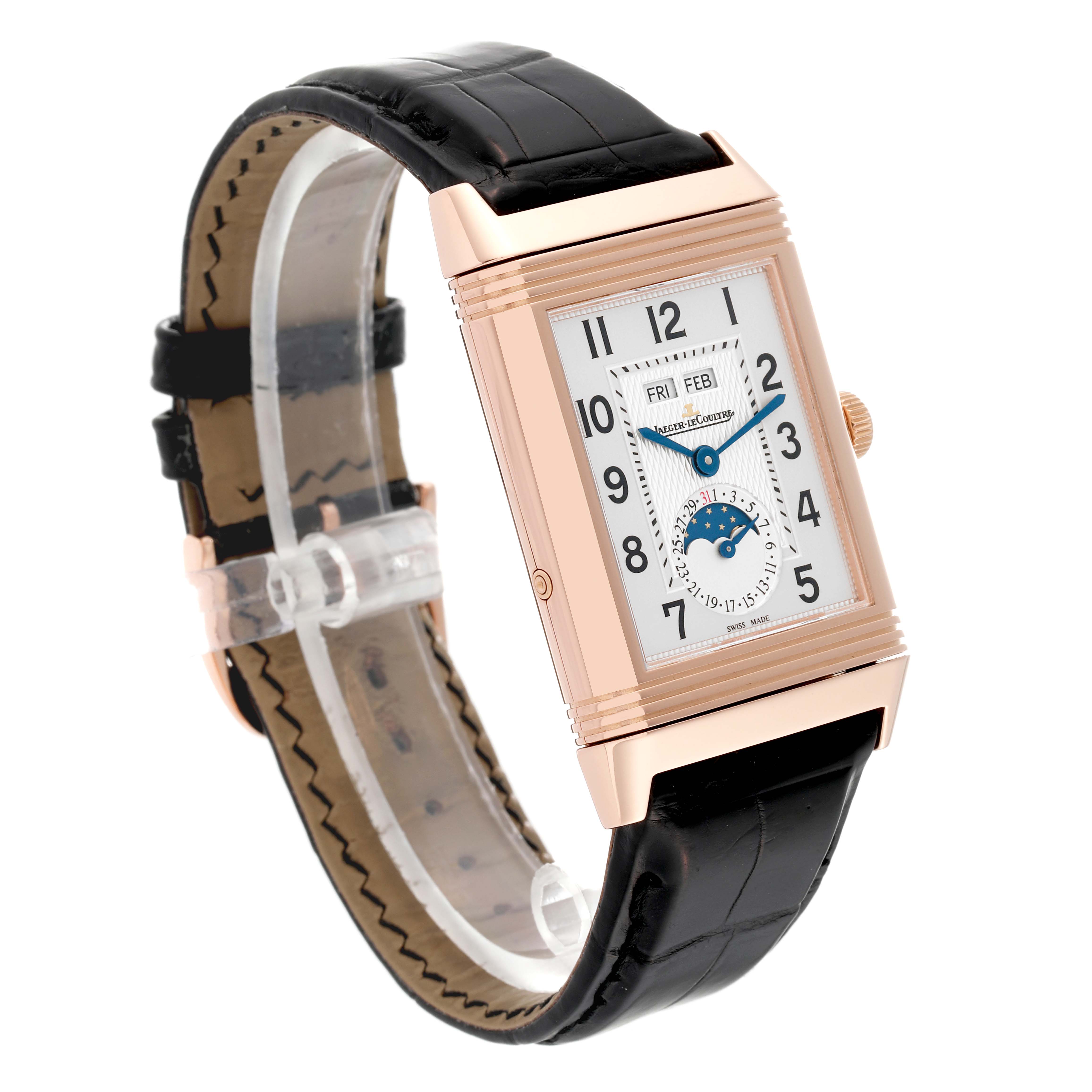 This Jaeger-LeCoultre Reverso watch is shown from an oblique angle, highlighting its rectangular case, dial, and black leather strap.