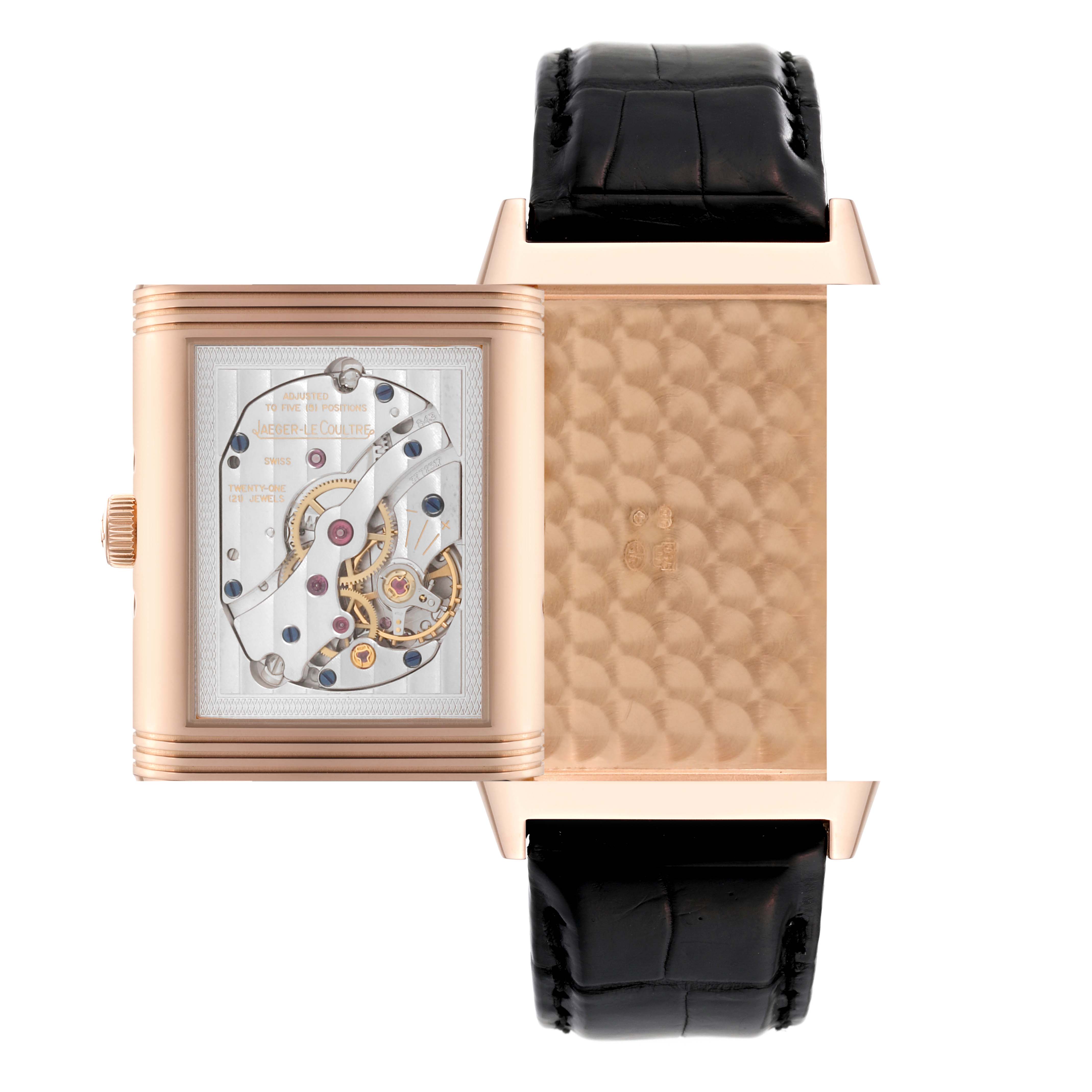 This image shows the front and back views of the Jaeger-LeCoultre Reverso watch with an exposed movement and a black leather strap.