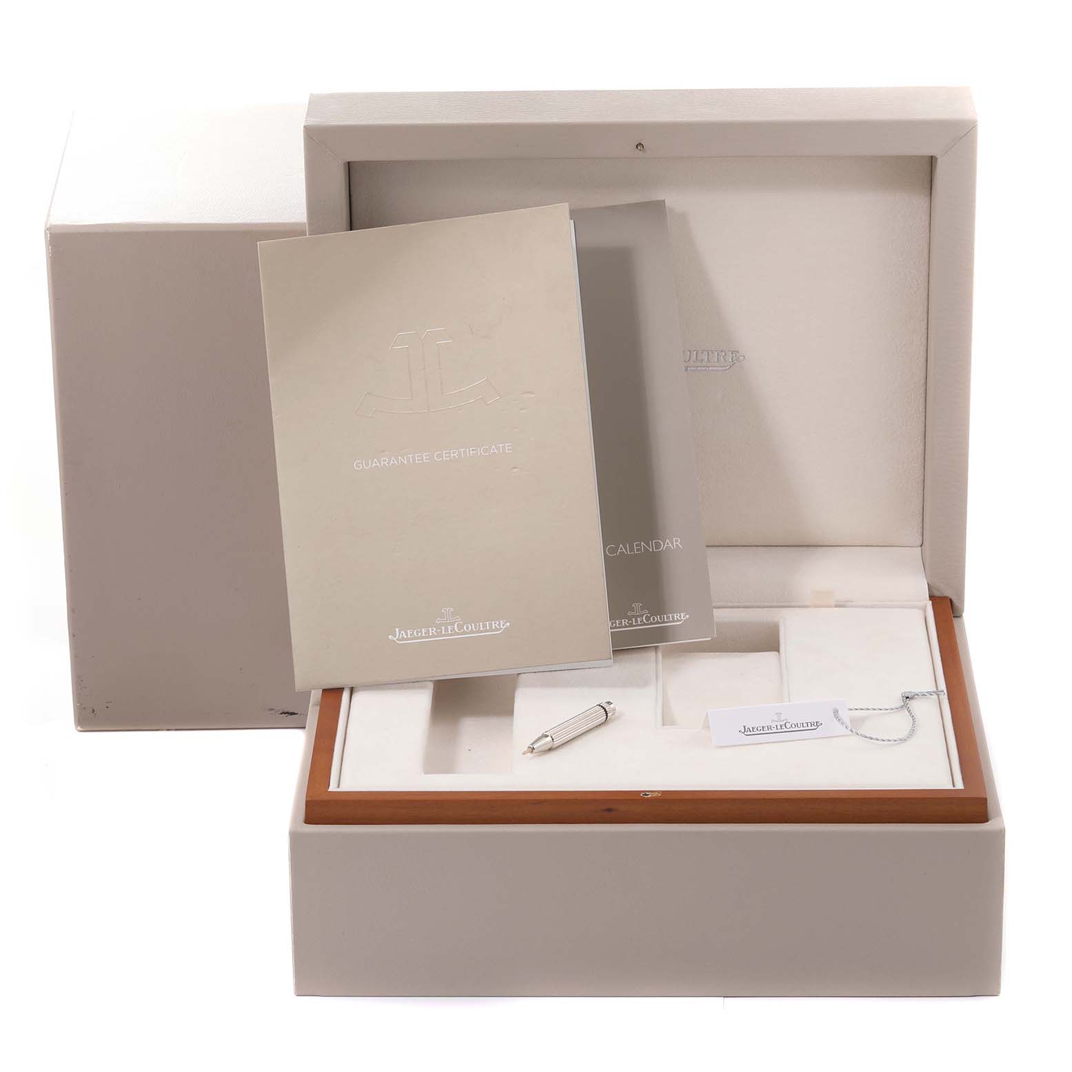 This image shows the packaging, manuals, and accessories for a Jaeger LeCoultre Reverso Q3752520 Men's Rose Gold Silver Dial Q3752520 Men's Rose Gold Silver Dial watch.