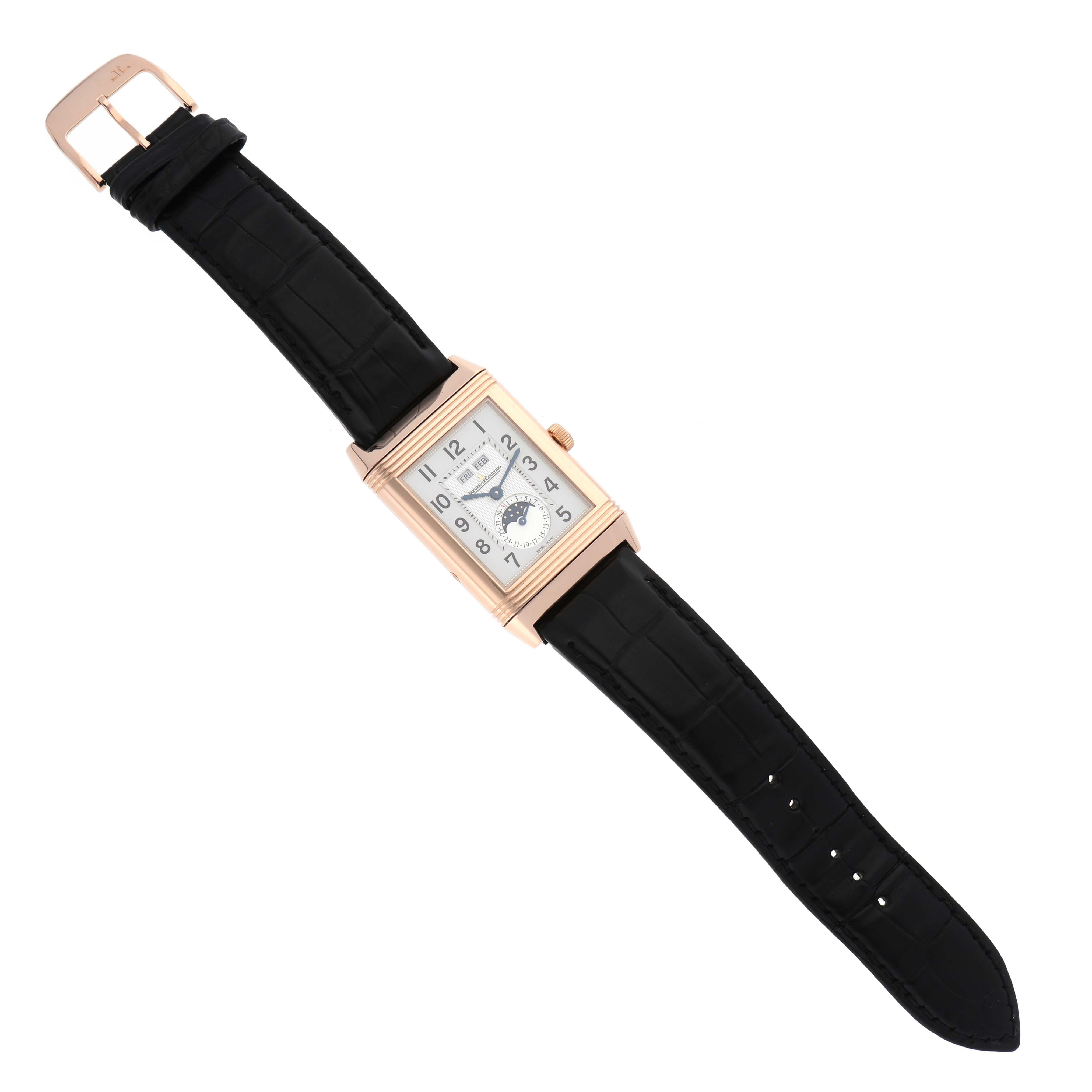 The image shows a Jaeger LeCoultre Reverso Q3752520 Men's Rose Gold Silver Dial Q3752520 Men's Rose Gold Silver Dial watch from a top-down angle, displaying the dial, rectangular case, and black leather strap.