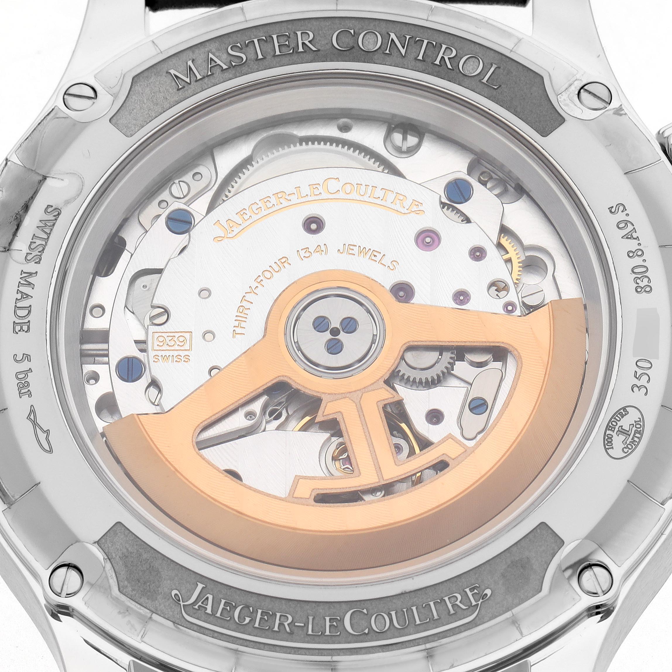 The image displays the case back of a Jaeger-LeCoultre Master model, showing its mechanical movement and rotor detail.