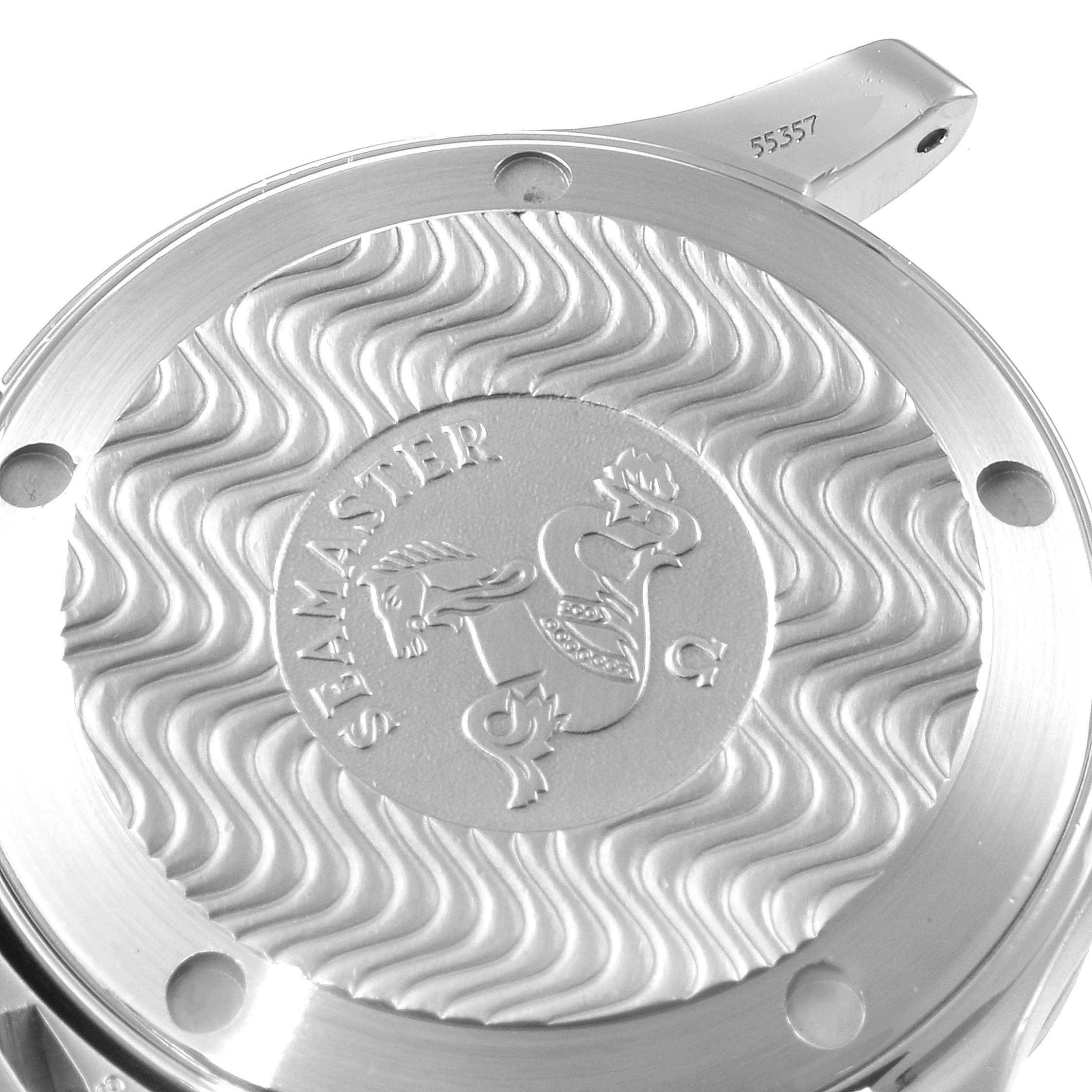 The image shows the back of an Omega Seamaster 2561.80.00 Men
s Stainless Steel Blue Dial 2561.80.00 Men
s Stainless Steel Blue Dial watch with its engraved emblem and wave pattern design.