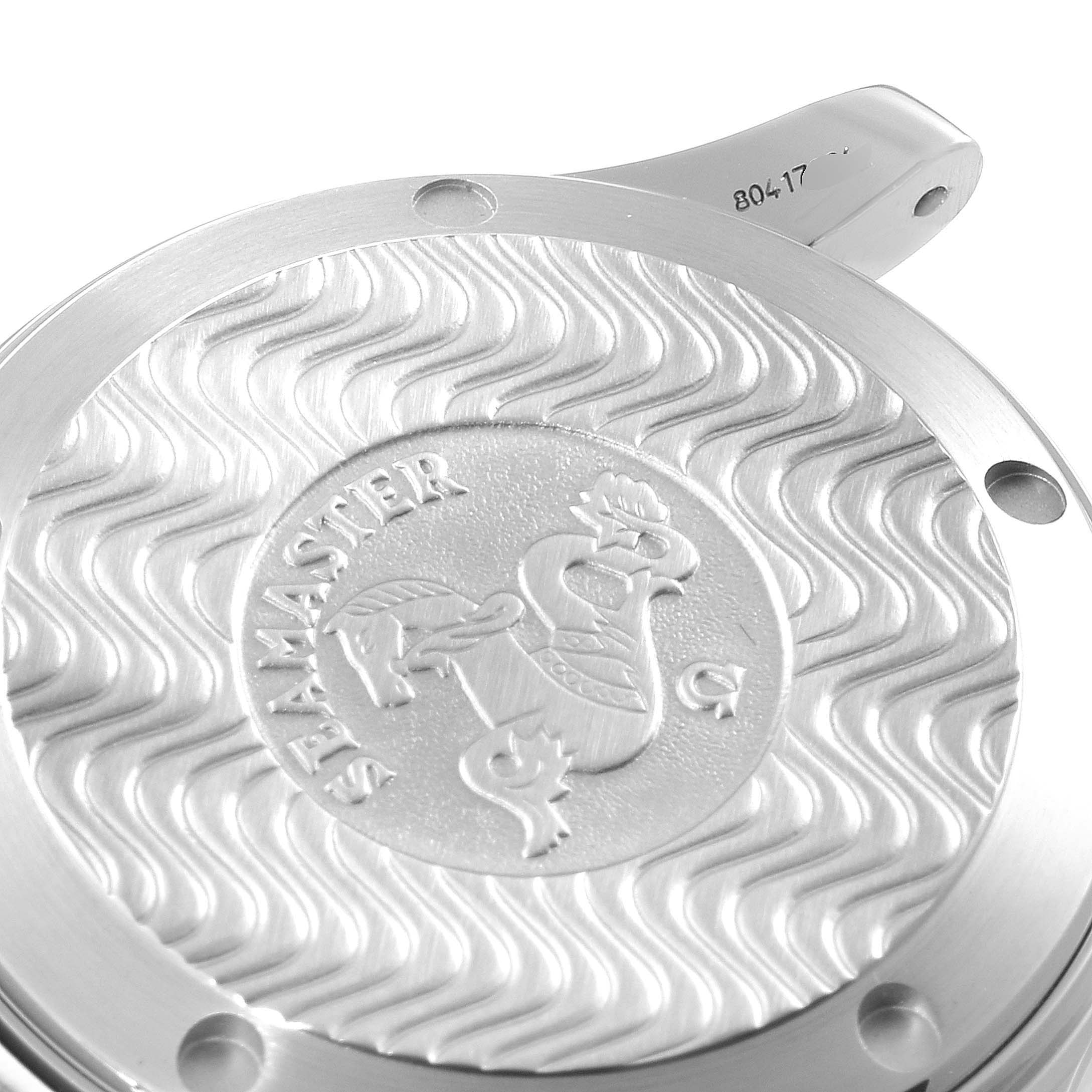 This image shows a close-up of the backside of the Omega Seamaster 2551.80.00 Men
s Stainless Steel Blue Dial 2551.80.00 Men
s Stainless Steel Blue Dial watch, highlighting the engraving and design.