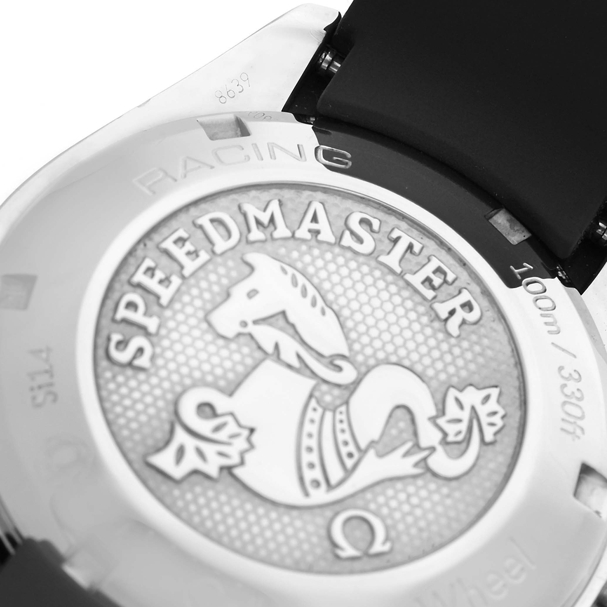 The image shows the case back of an Omega Speedmaster 326.32.40.50.11.001 Men's Stainless Steel Red Dial, highlighting its embossed logo and water resistance details.