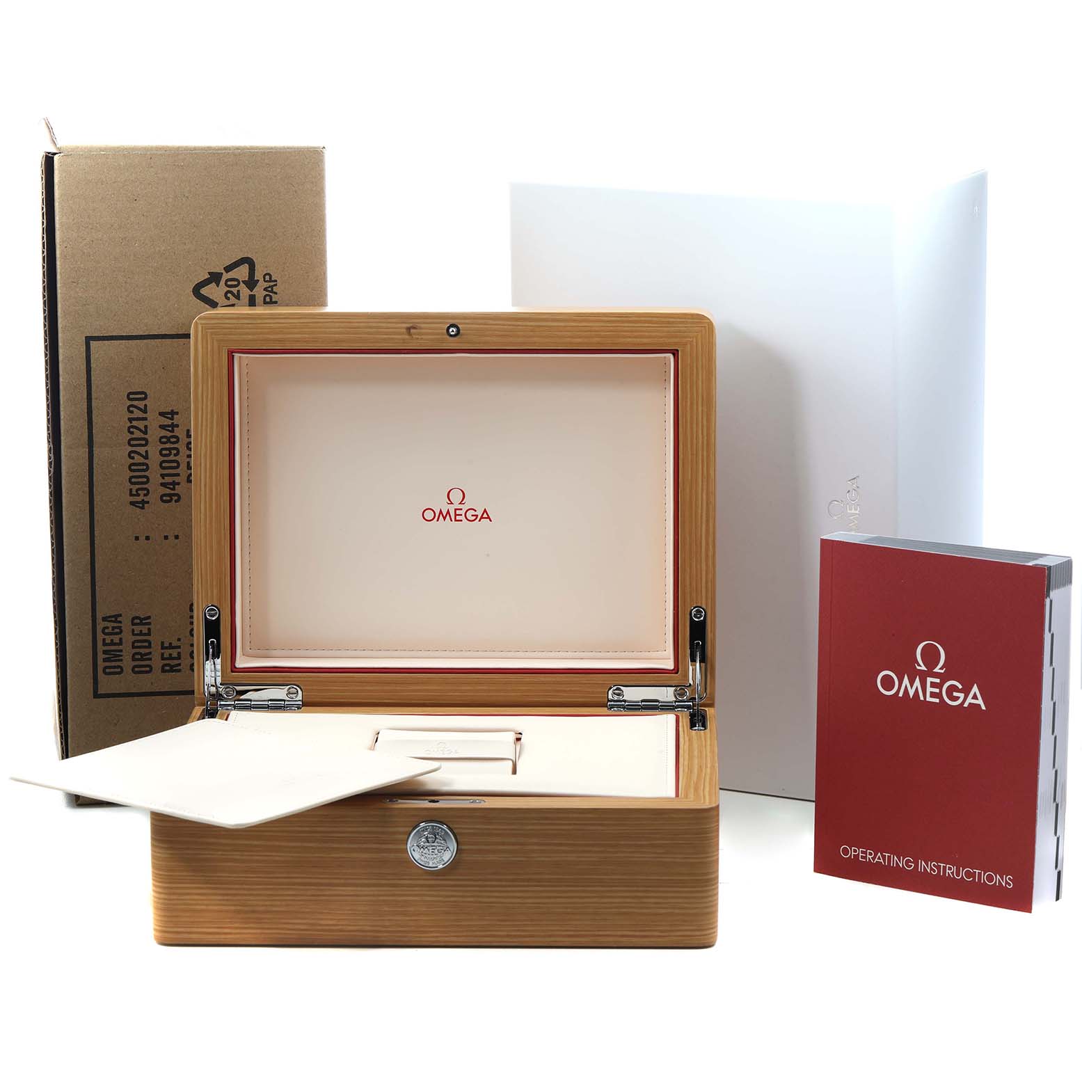 The image shows the Omega Speedmaster 326.32.40.50.11.001 Men's Stainless Steel Red Dial packaging, including a wooden box, outer box, and operating instructions.