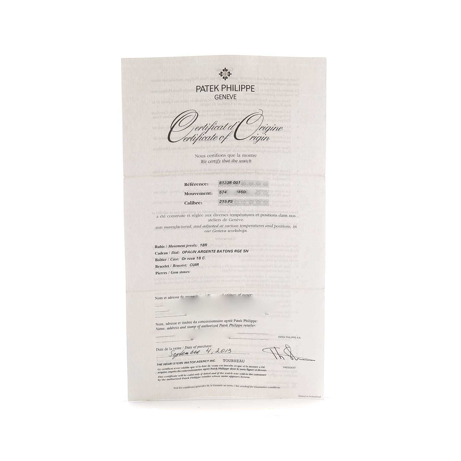 The image shows a Certificate of Origin for a Patek Philippe Calatrava 5123R Men's Rose Gold Silver Dial watch, featuring detailed text and signatures.