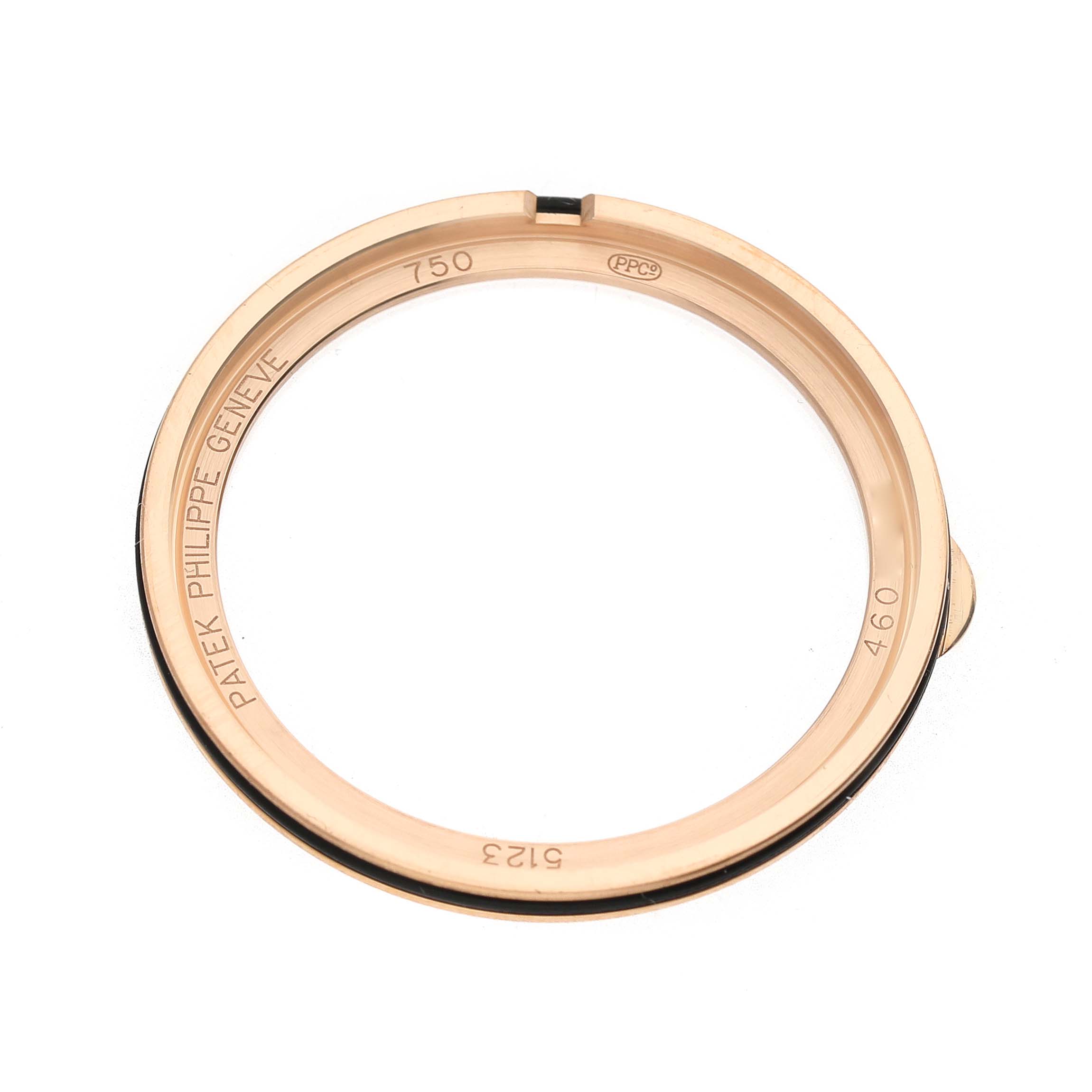 The image shows a Patek Philippe Calatrava 5123R Men's Rose Gold Silver Dial bezel viewed from the side, displaying engraved details.
