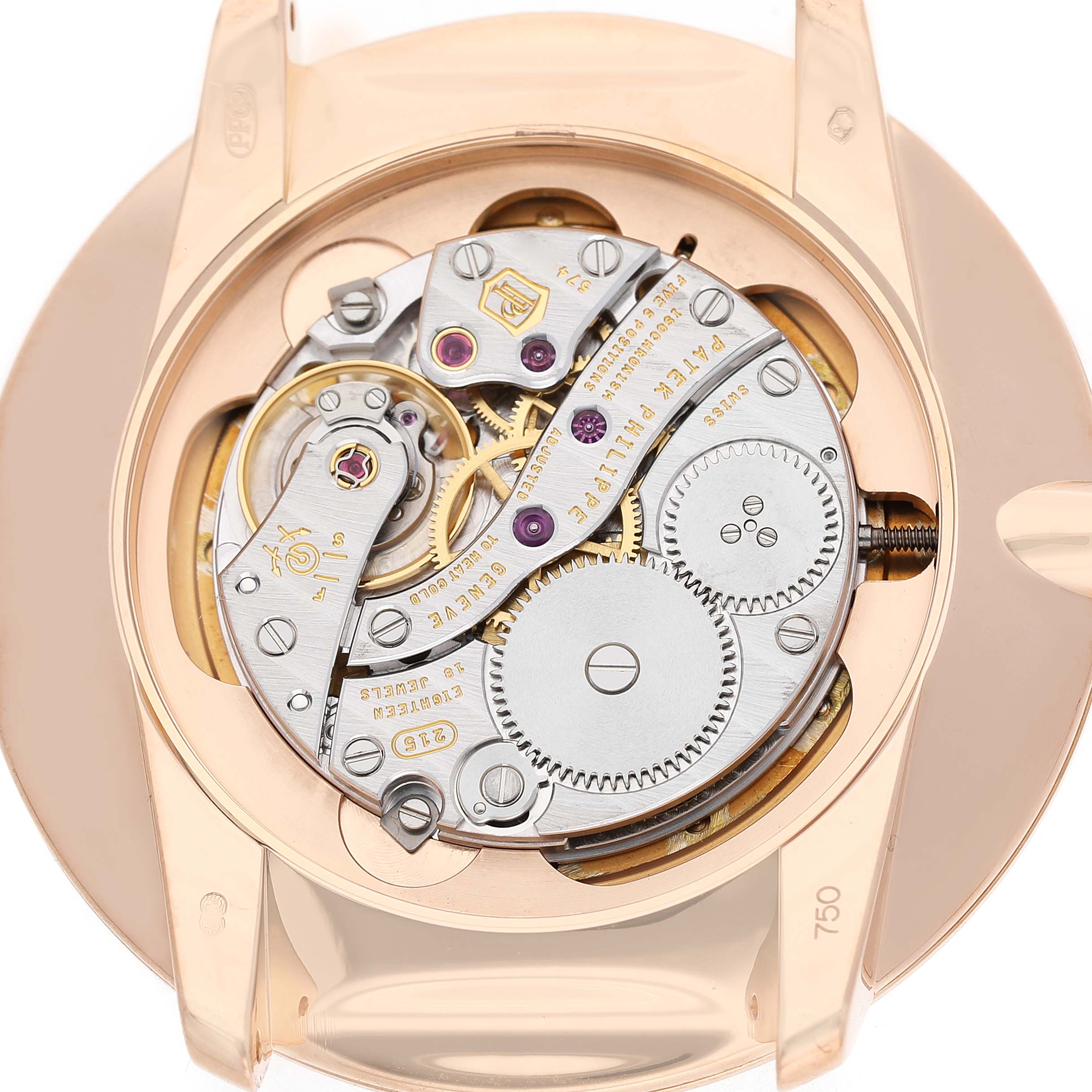 The image shows a close-up of the back of a Patek Philippe Calatrava 5123R Men's Rose Gold Silver Dial, highlighting the intricate movement mechanics.