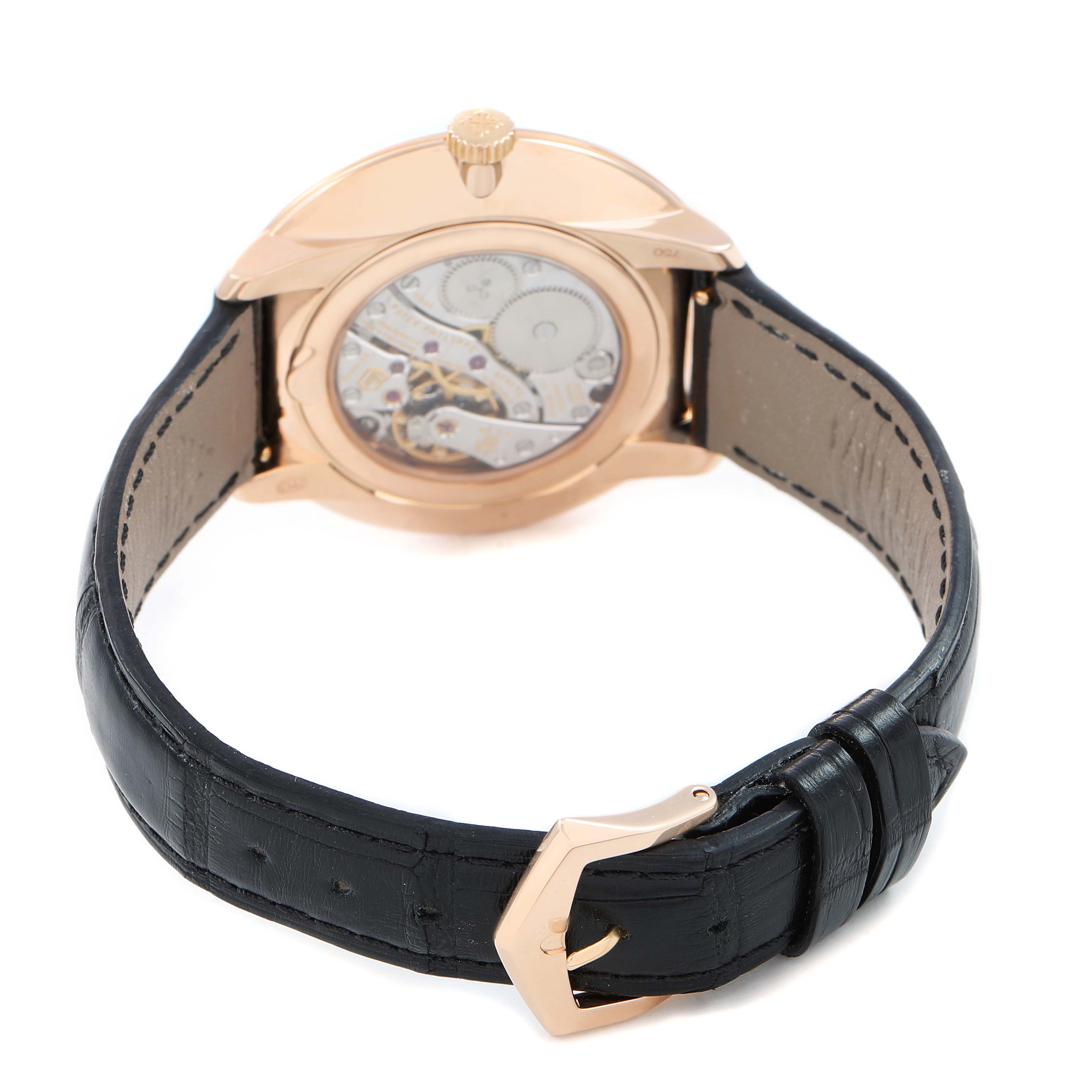 The Patek Philippe Calatrava 5123R Men's Rose Gold Silver Dial is shown from the back, highlighting the movement and black leather strap.