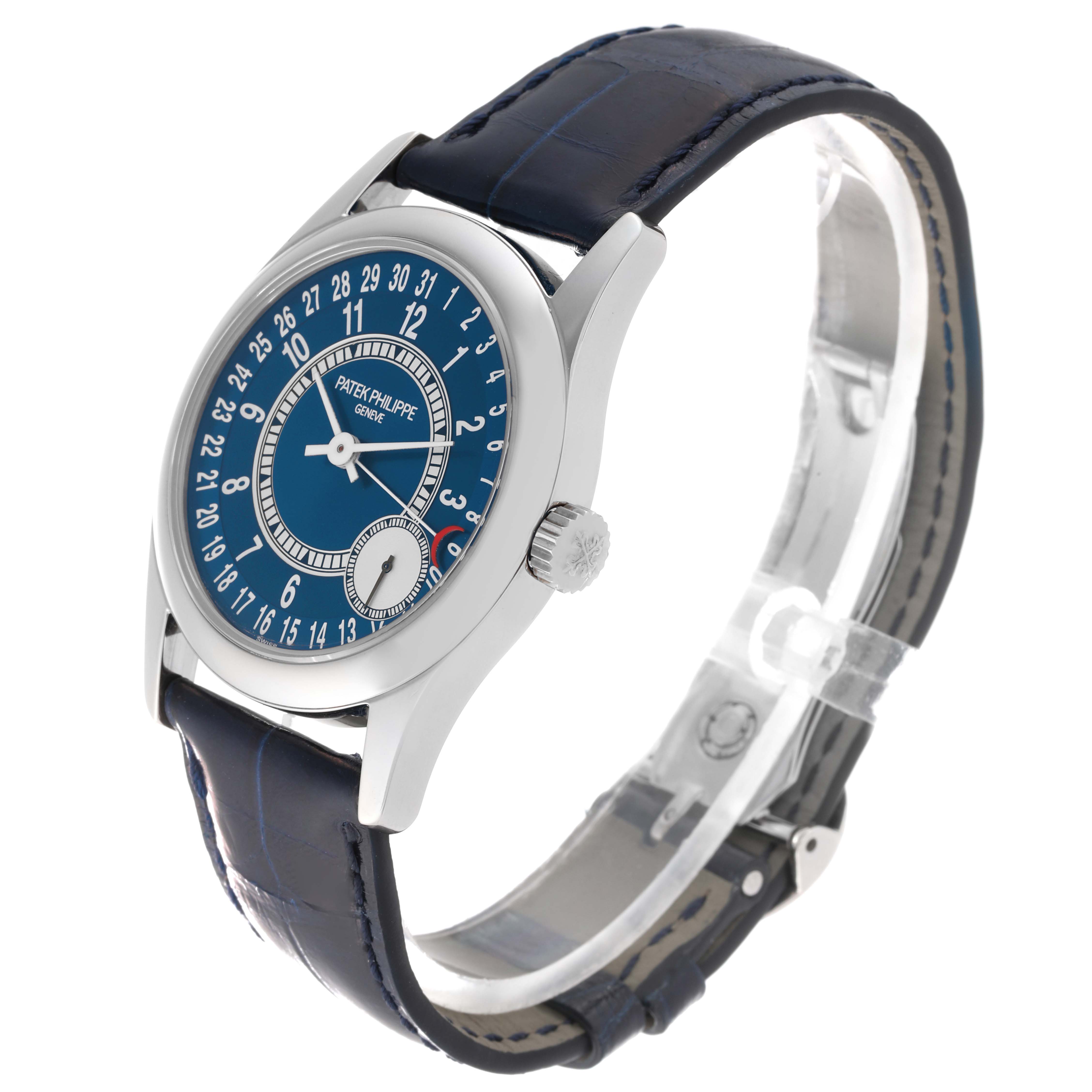 This image shows a side angle of a Patek Philippe Calatrava 6000G-012 Men's White Gold Blue Dial 6000G-012 Men's White Gold Blue Dial watch, highlighting the blue dial, leather strap, and crown.