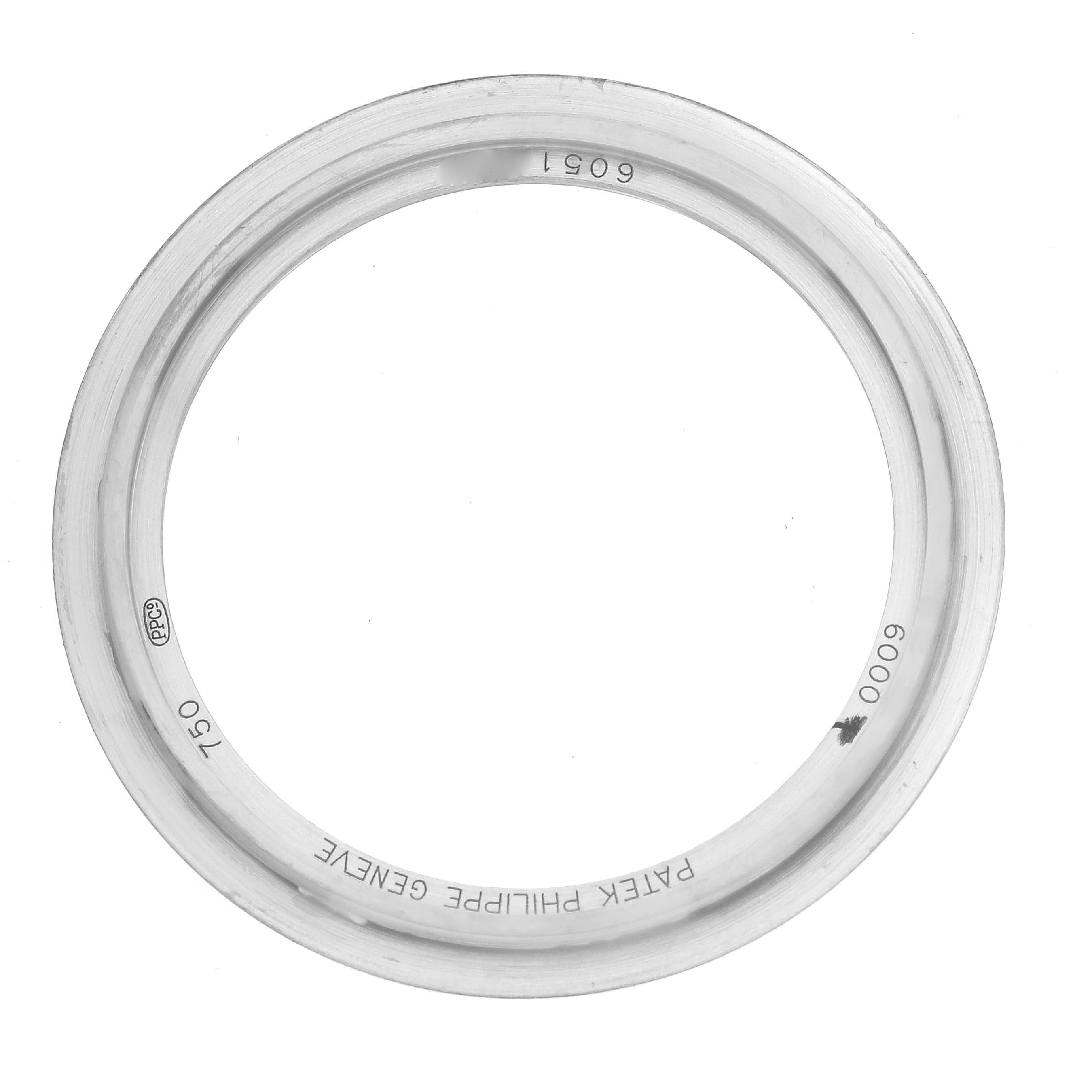 This image shows the bezel of a Calatrava model by Patek Philippe from a top-down angle.