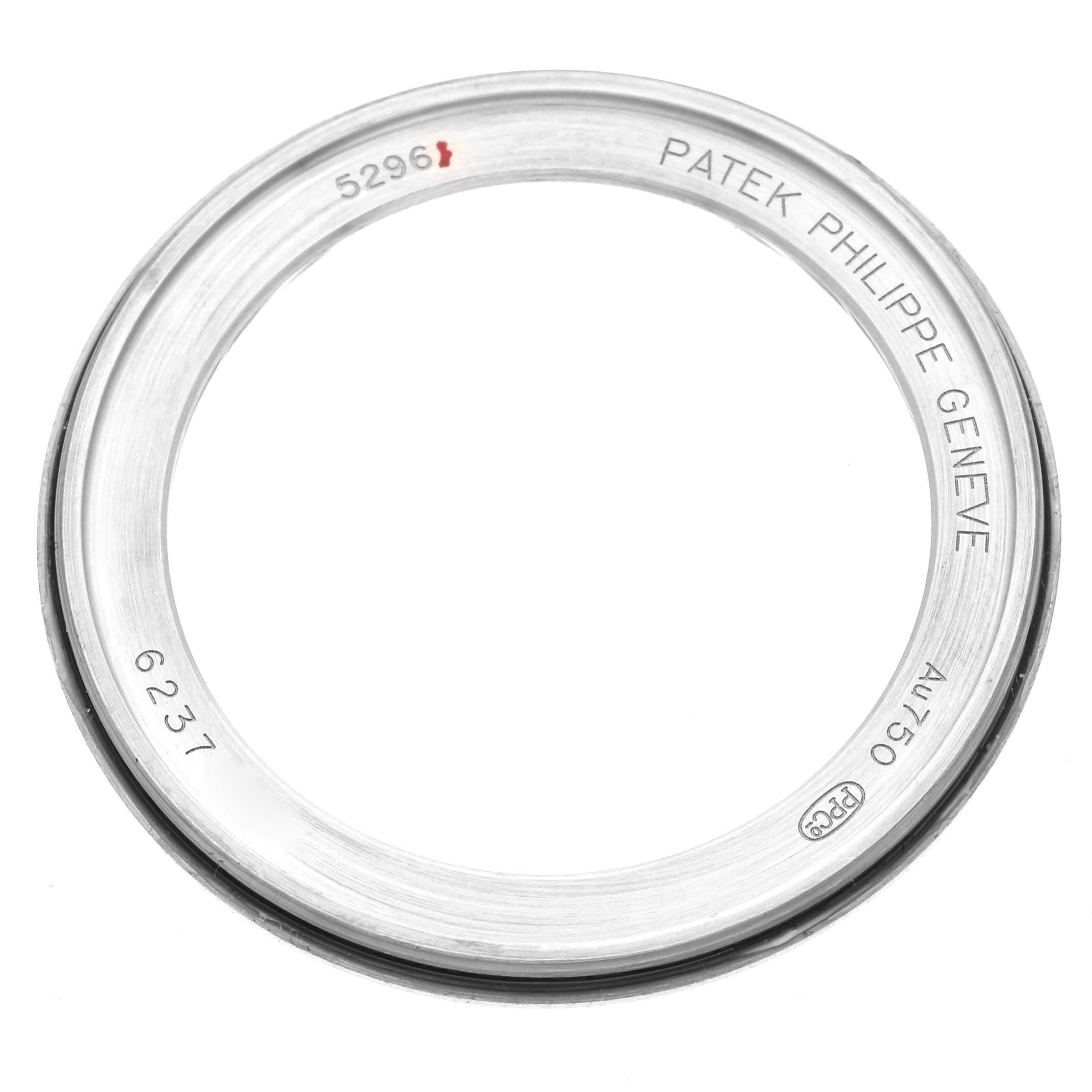 This image shows the bezel of a Patek Philippe Calatrava 5296G-001 Men's White Gold Silver Dial 5296G-001 Men's White Gold Silver Dial model, with inscriptions including "Patek Philippe Geneve" and "AU750."